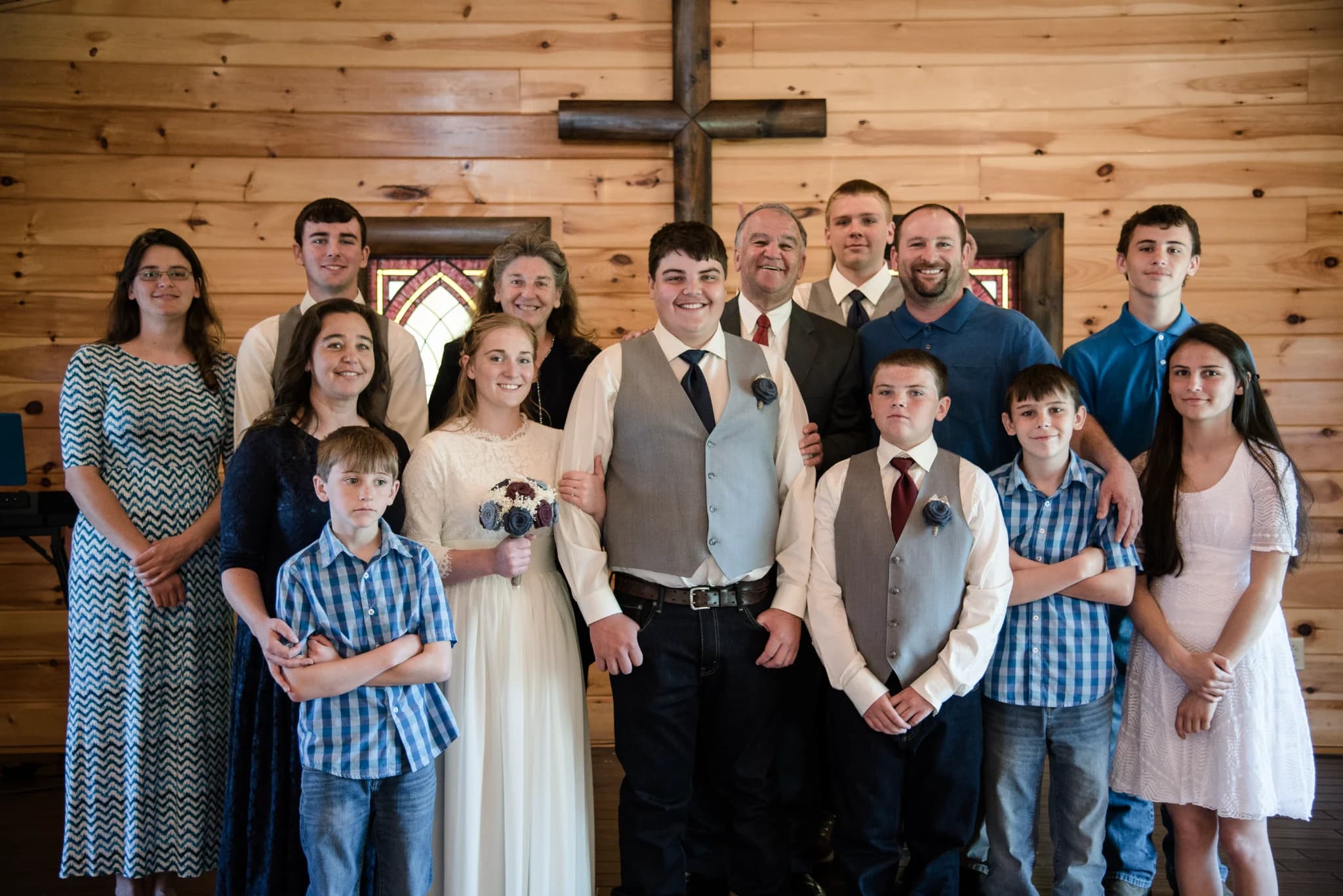 Rustic wedding chapel with wooden cross and stained glass at Moose Hollow Lodge in Pigeon Forge
