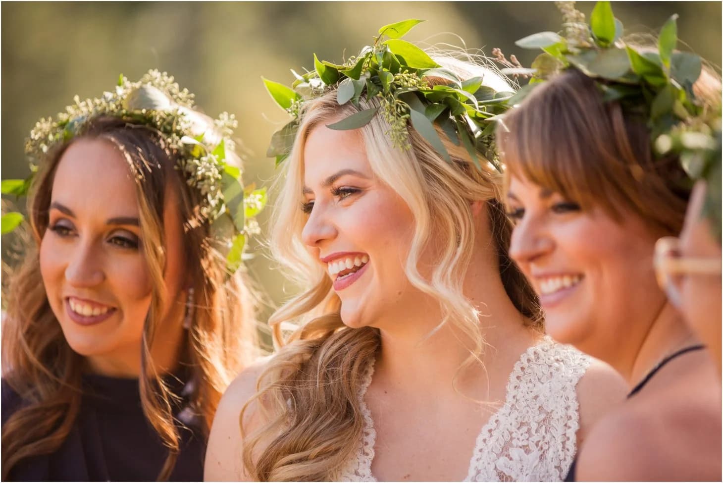 Smiling bride and bridesmaids in flower crowns at Moose Hollow Lodge in Pigeon Forge near the Smoky Mountains