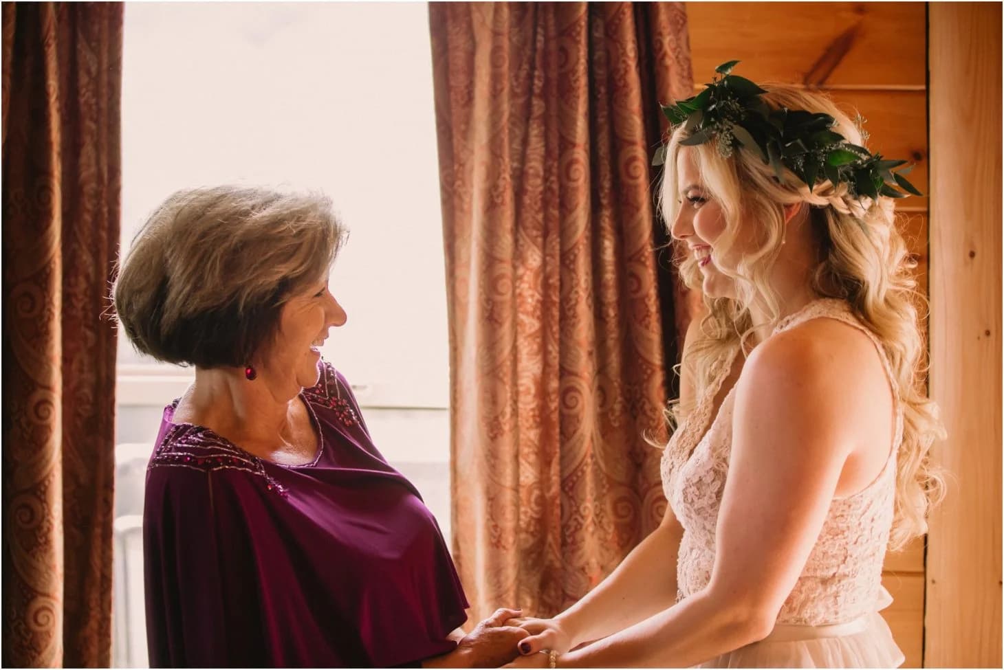Bride in a flower crown and mother in a wood-paneled room at Moose Hollow Lodge in Pigeon Forge