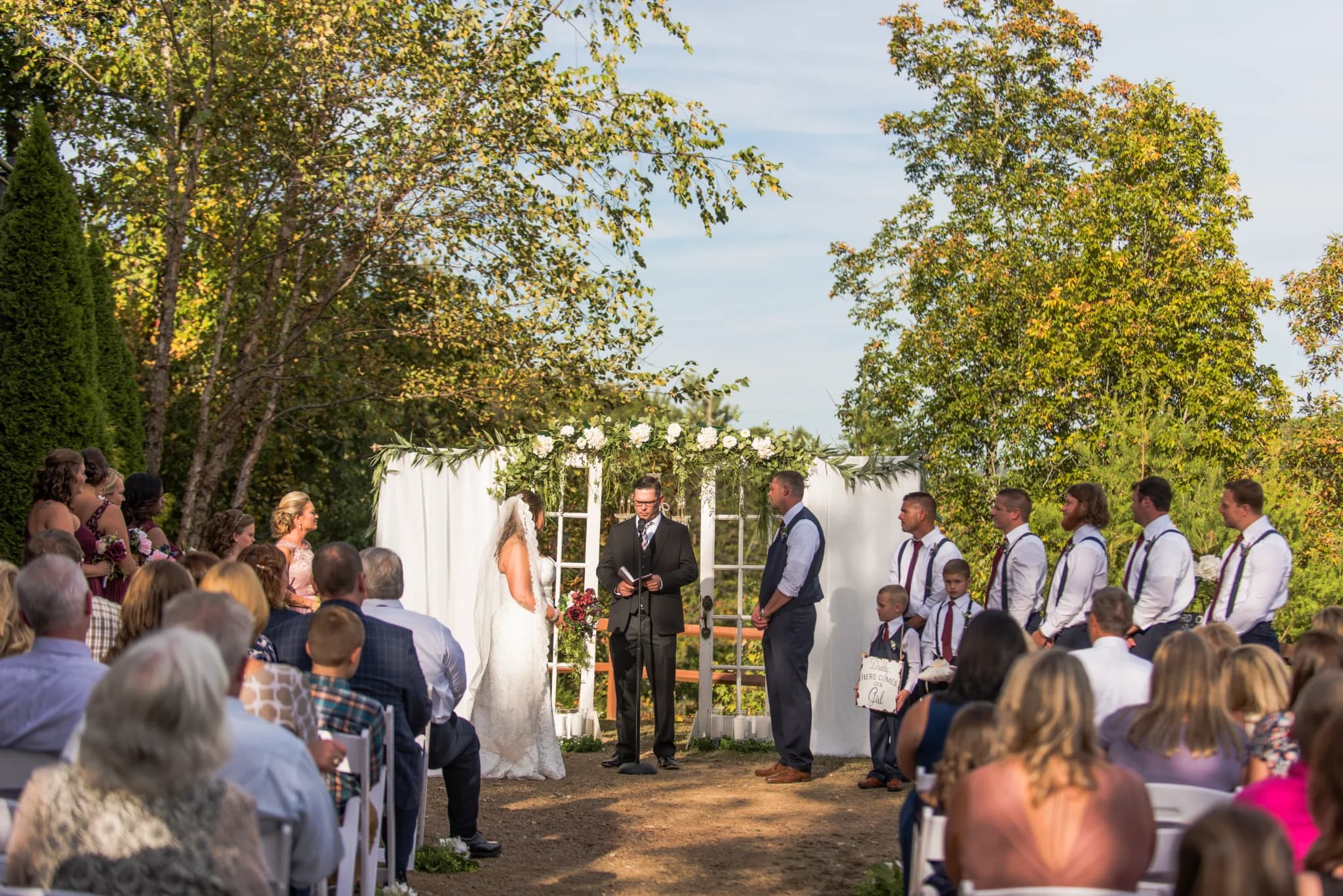 Outdoor wedding ceremony with floral arch near Dollywood at Moose Hollow Lodge in Pigeon Forge and Smoky Mountains.