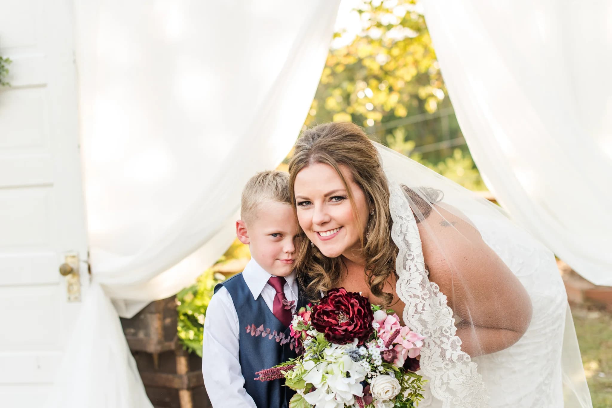 Bride with lace veil and bouquet at outdoor wedding at Moose Hollow Lodge in Pigeon Forge near Smoky Mountains