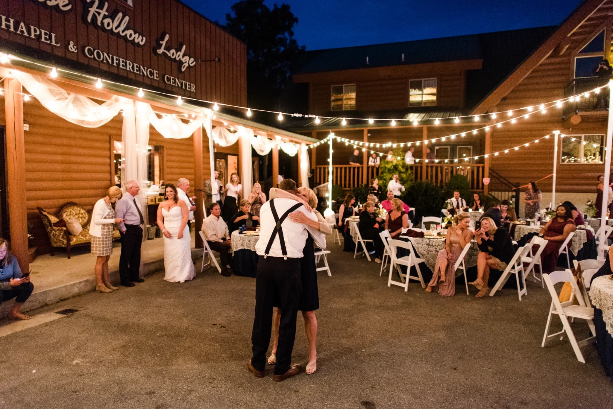 Outdoor wedding reception with string lights and guest tables at Moose Hollow Lodge in Pigeon Forge near Smoky Mountains