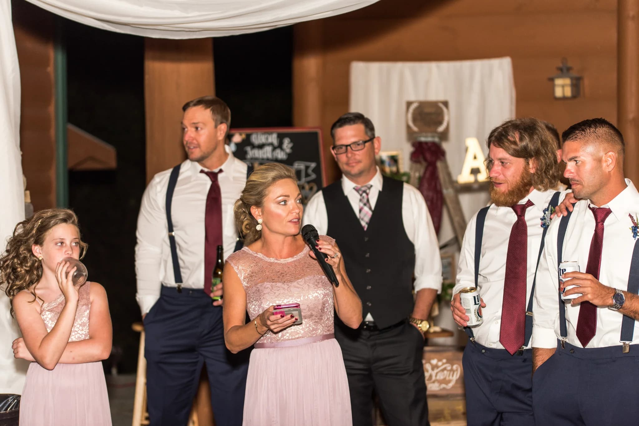 Wedding reception toast in a rustic log cabin venue at Moose Hollow Lodge in Pigeon Forge near the Smoky Mountains