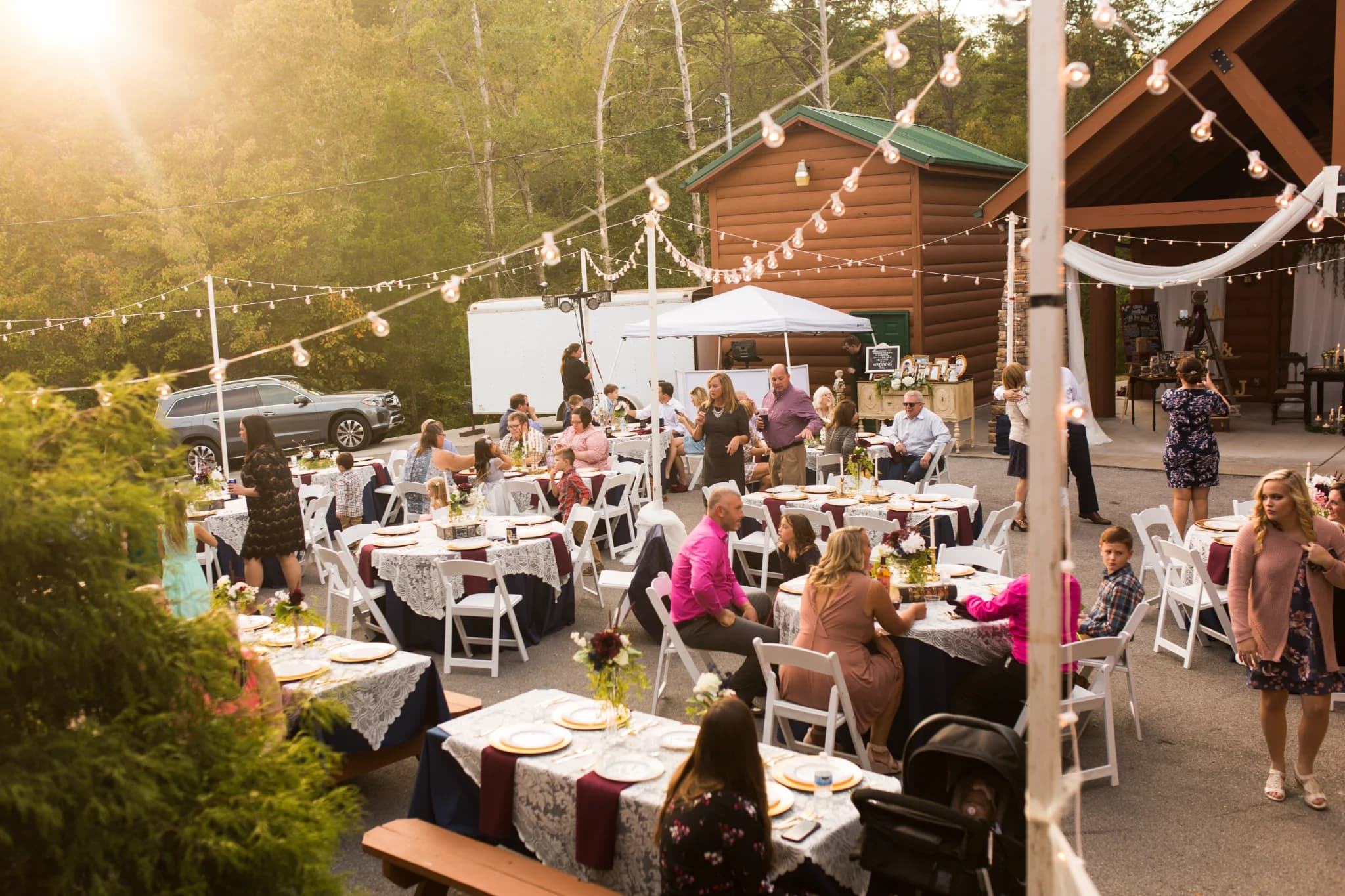 Outdoor wedding reception with string lights and guest tables at Moose Hollow Lodge in Pigeon Forge near Smoky Mountains