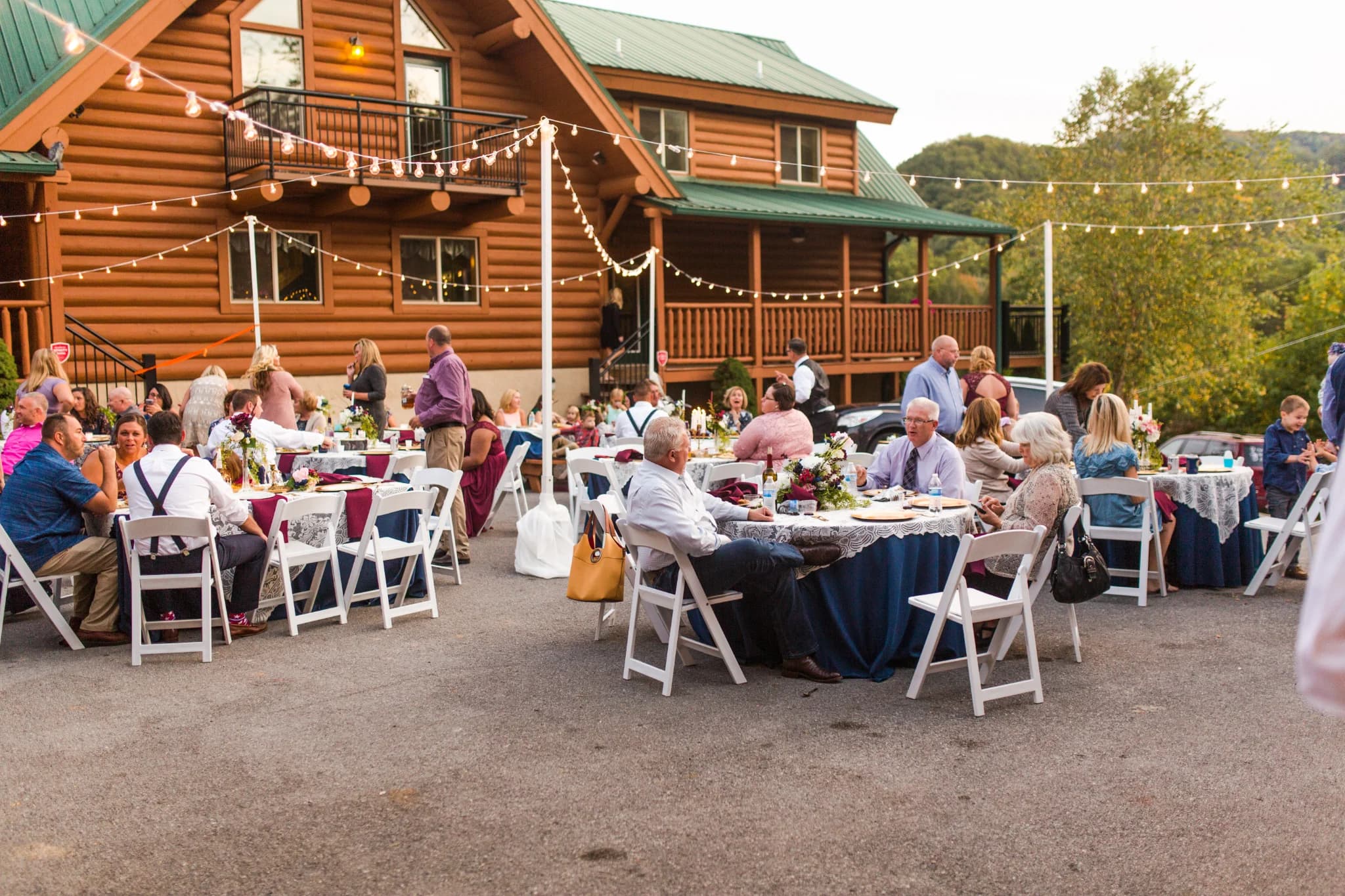 Outdoor wedding reception with string lights at Moose Hollow Lodge in Pigeon Forge near Dollywood and Smoky Mountains