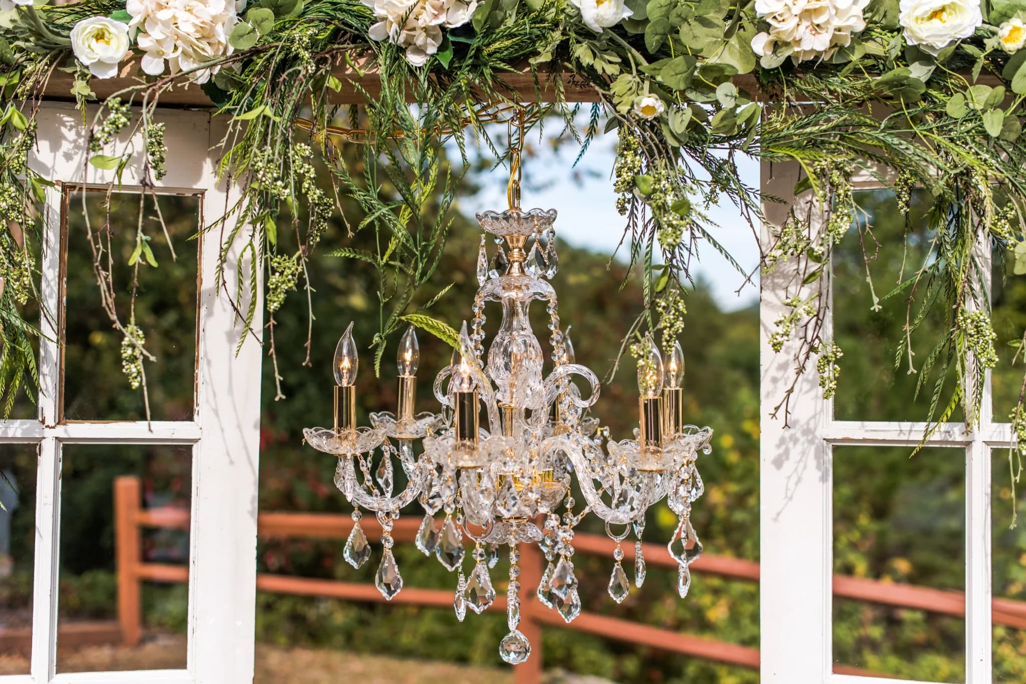 Floral wedding arbor with crystal chandelier at Moose Hollow Lodge in Pigeon Forge near the Smoky Mountains