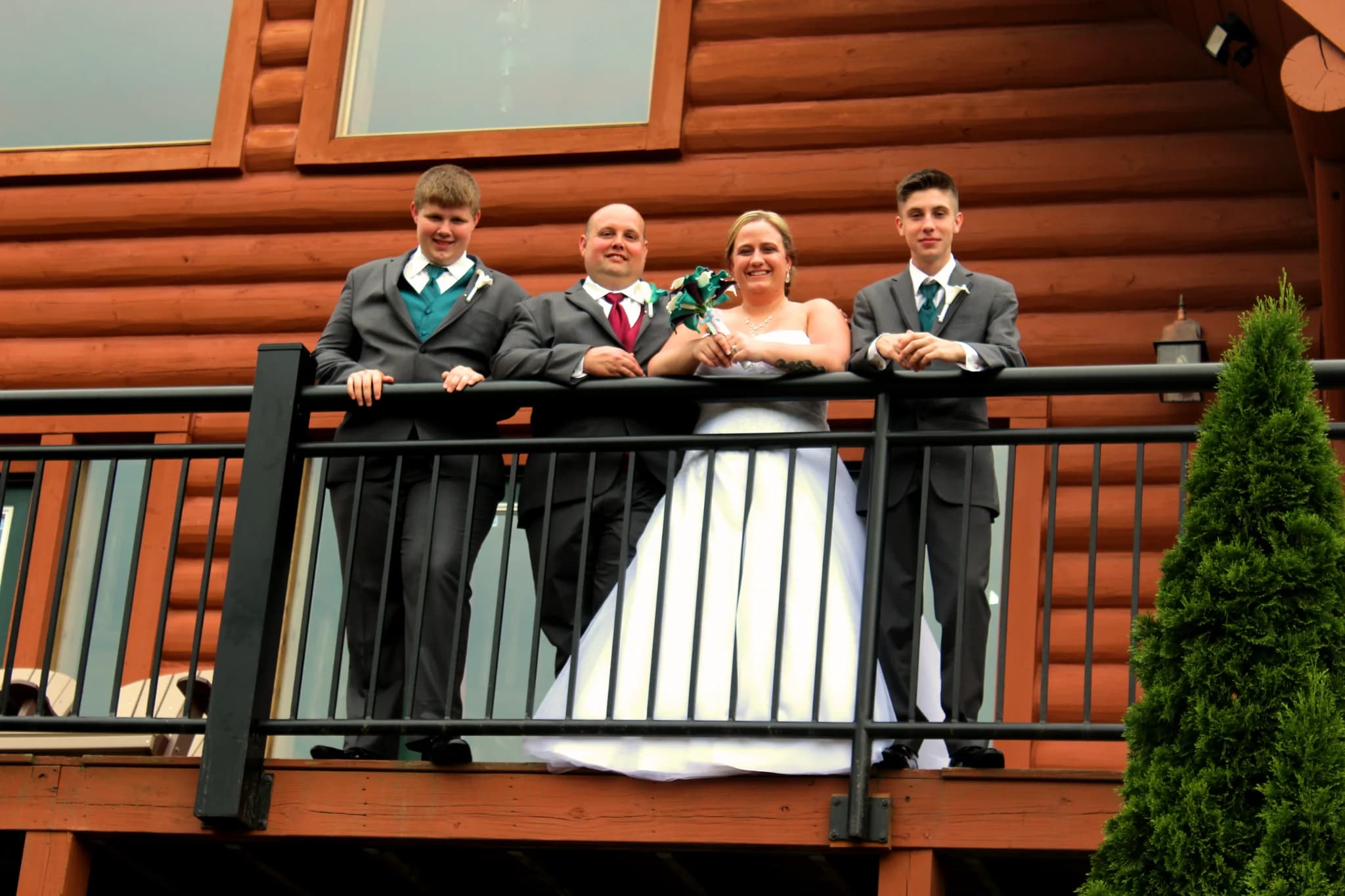 Wedding party on a log cabin deck near the Smoky Mountains at Moose Hollow Lodge in Pigeon Forge