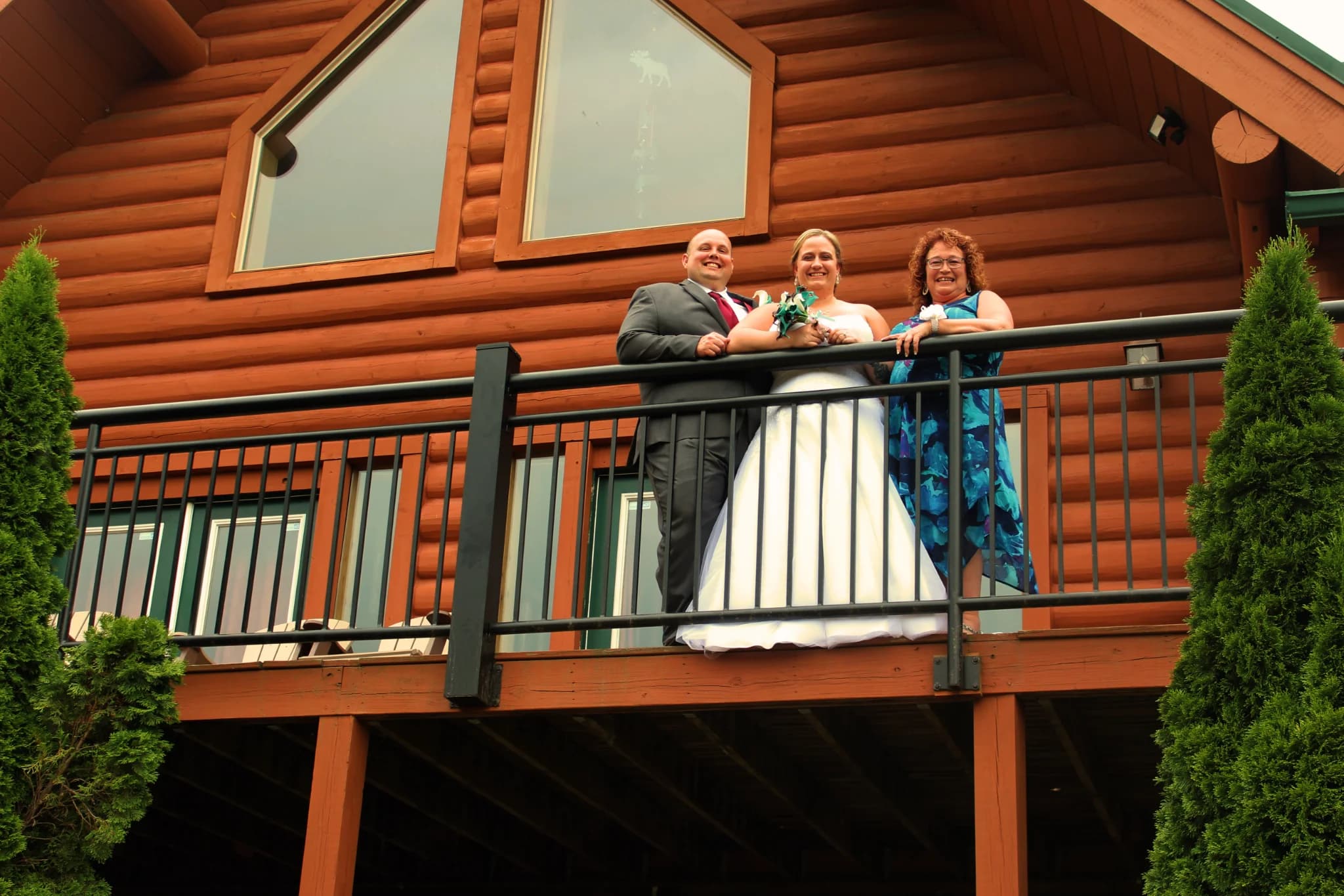 Wedding party on a rustic log cabin deck near Dollywood at Moose Hollow Lodge in Pigeon Forge