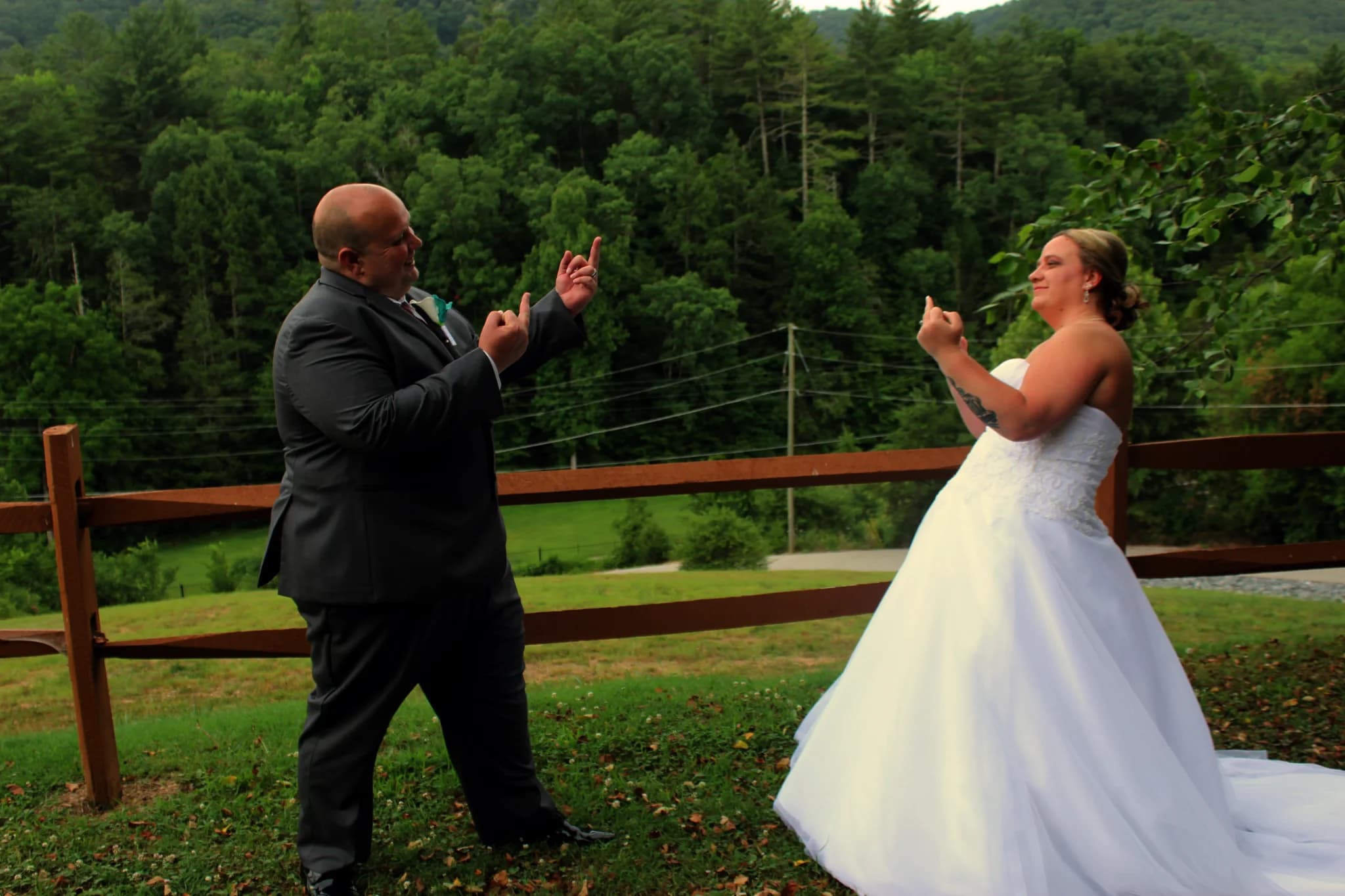 Playful wedding couple outdoors with forest views at Moose Hollow Lodge in Pigeon Forge near the Smoky Mountains.