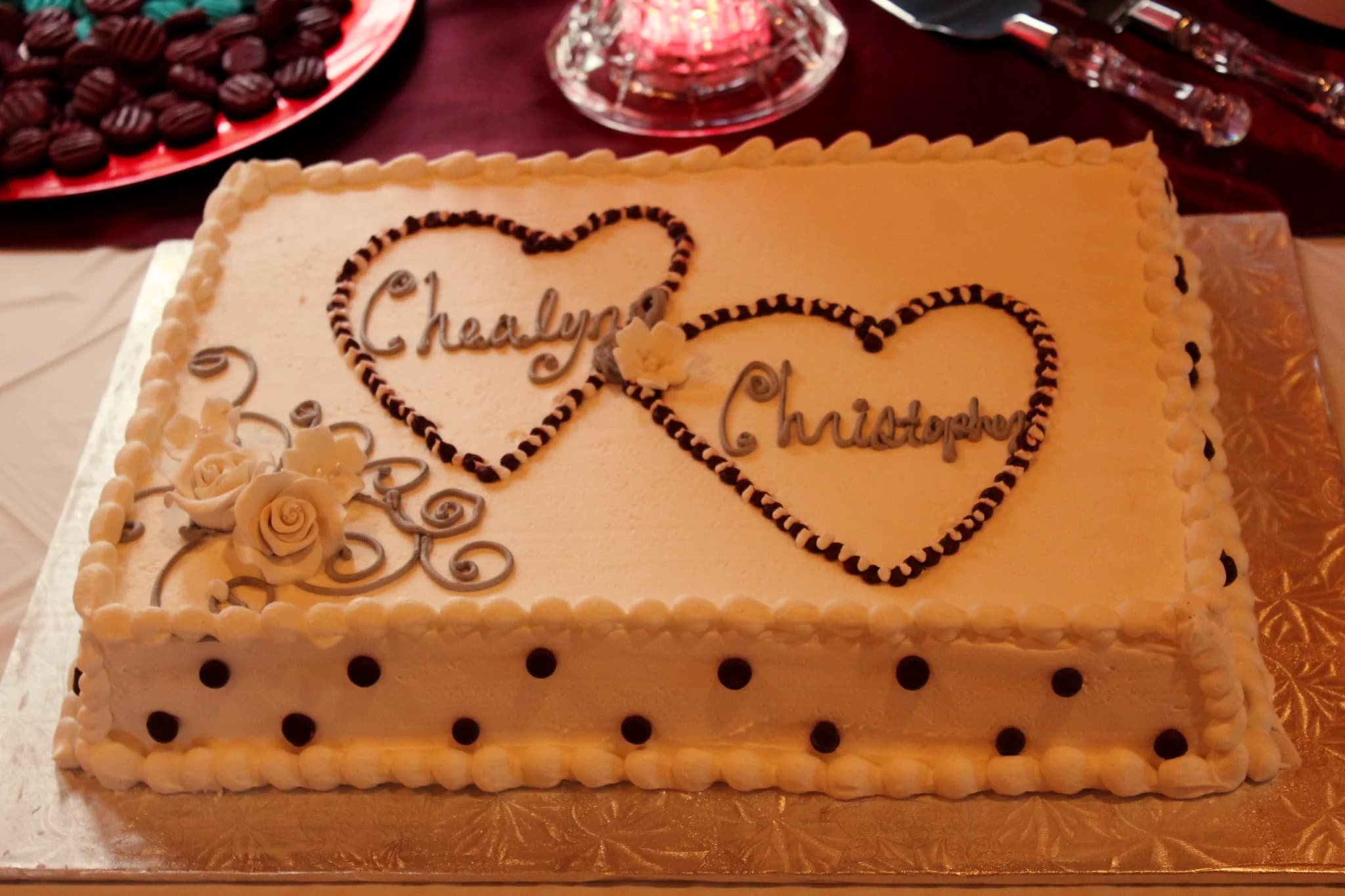 White wedding sheet cake with decorative hearts and frosting roses at Moose Hollow Lodge in Pigeon Forge