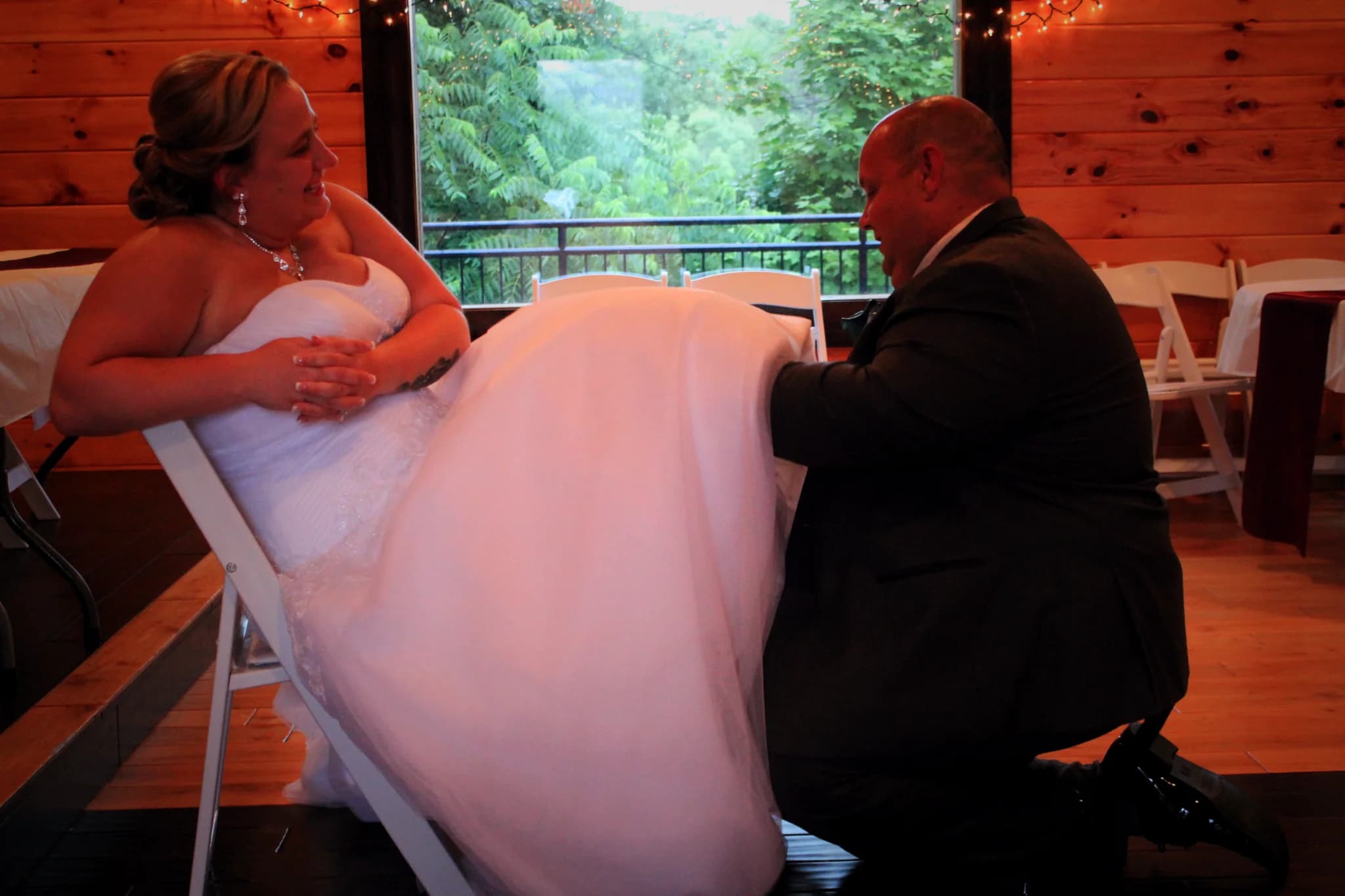 Rustic wedding hall with log walls and forest views at Moose Hollow Lodge in Pigeon Forge