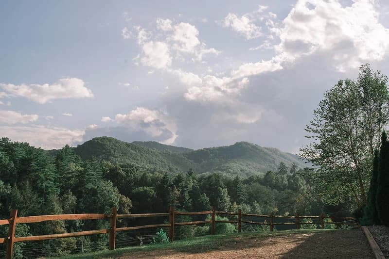 Scenic mountain views with a rustic wood fence at Moose Hollow Lodge near Dollywood in the Smoky Mountains