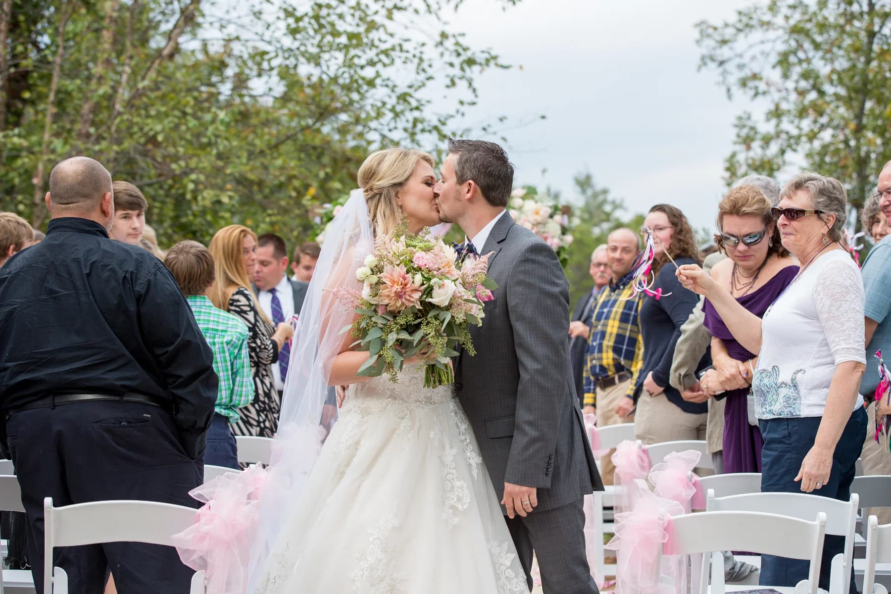 Outdoor wedding ceremony with white chairs and couple at Moose Hollow Lodge in Pigeon Forge near Smoky Mountains