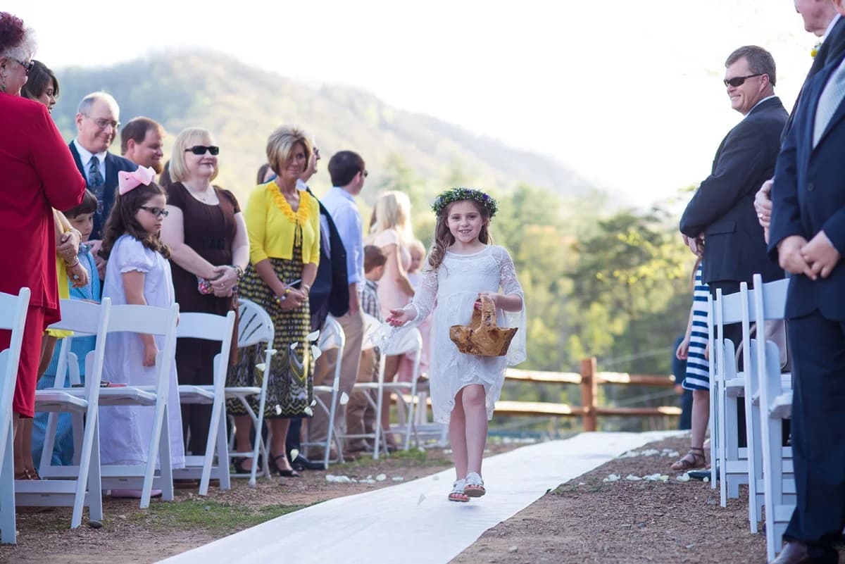 Outdoor wedding with flower girl and Smoky Mountain views at Moose Hollow Lodge near Dollywood in Pigeon Forge