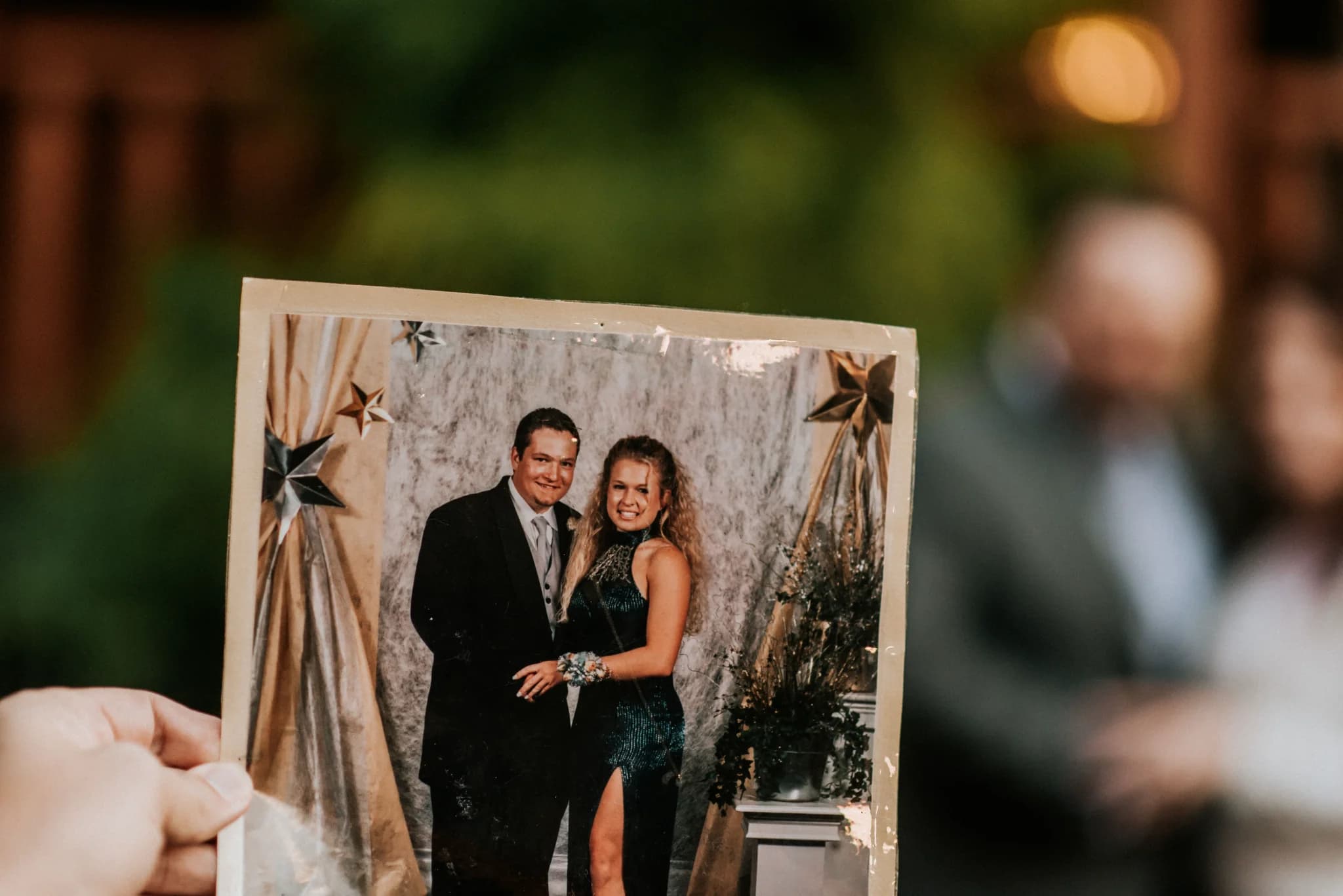 Hand holding a wedding photo at Moose Hollow Lodge in Pigeon Forge near the Smoky Mountains