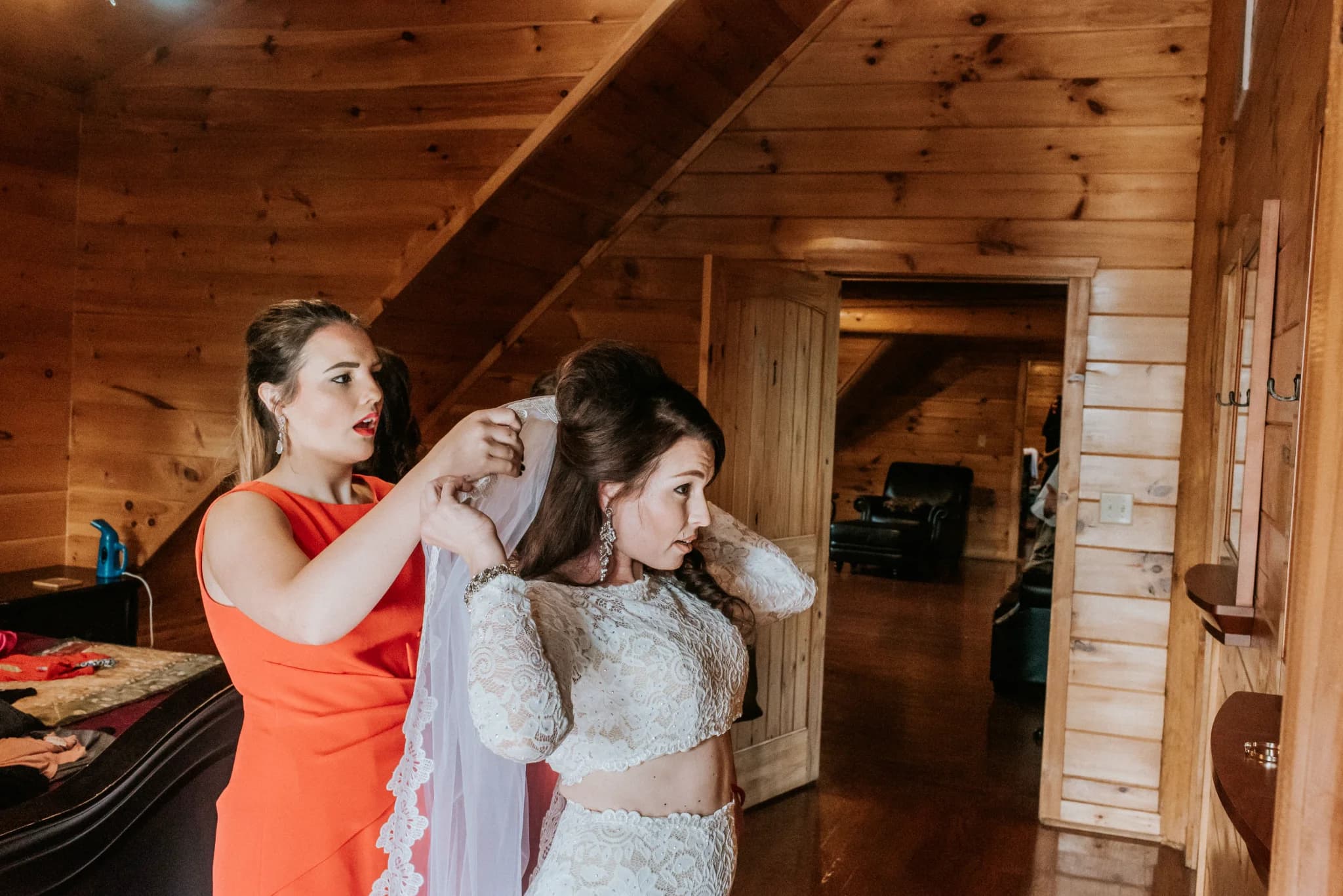 Bride getting ready in rustic wood-paneled bridal suite at Moose Hollow Lodge in Pigeon Forge