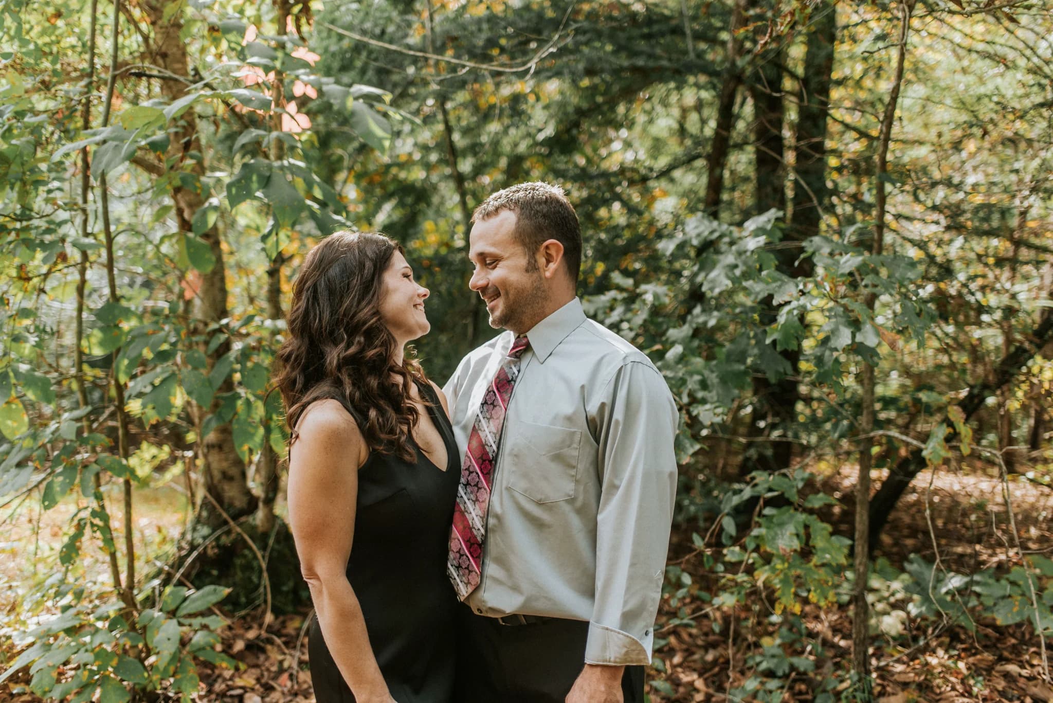Romantic couple in a wooded forest at Moose Hollow Lodge in Pigeon Forge near the Smoky Mountains