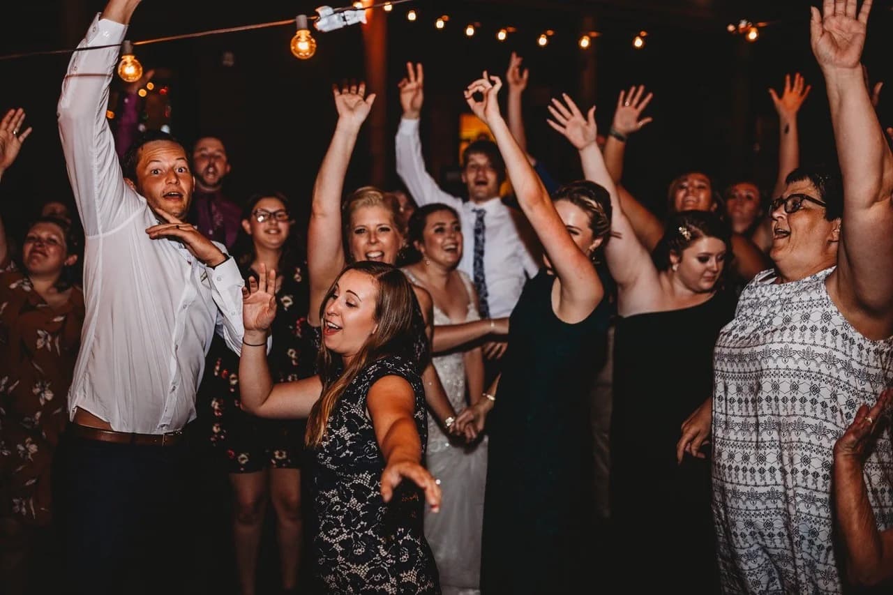 Wedding reception guests dancing under string lights at Moose Hollow Lodge in Pigeon Forge near Dollywood