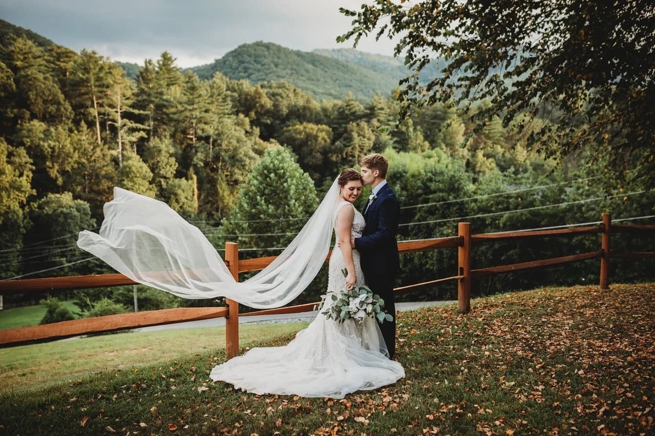 Wedding couple with flowing veil and Smoky Mountains views at Moose Hollow Lodge near Dollywood in Pigeon Forge