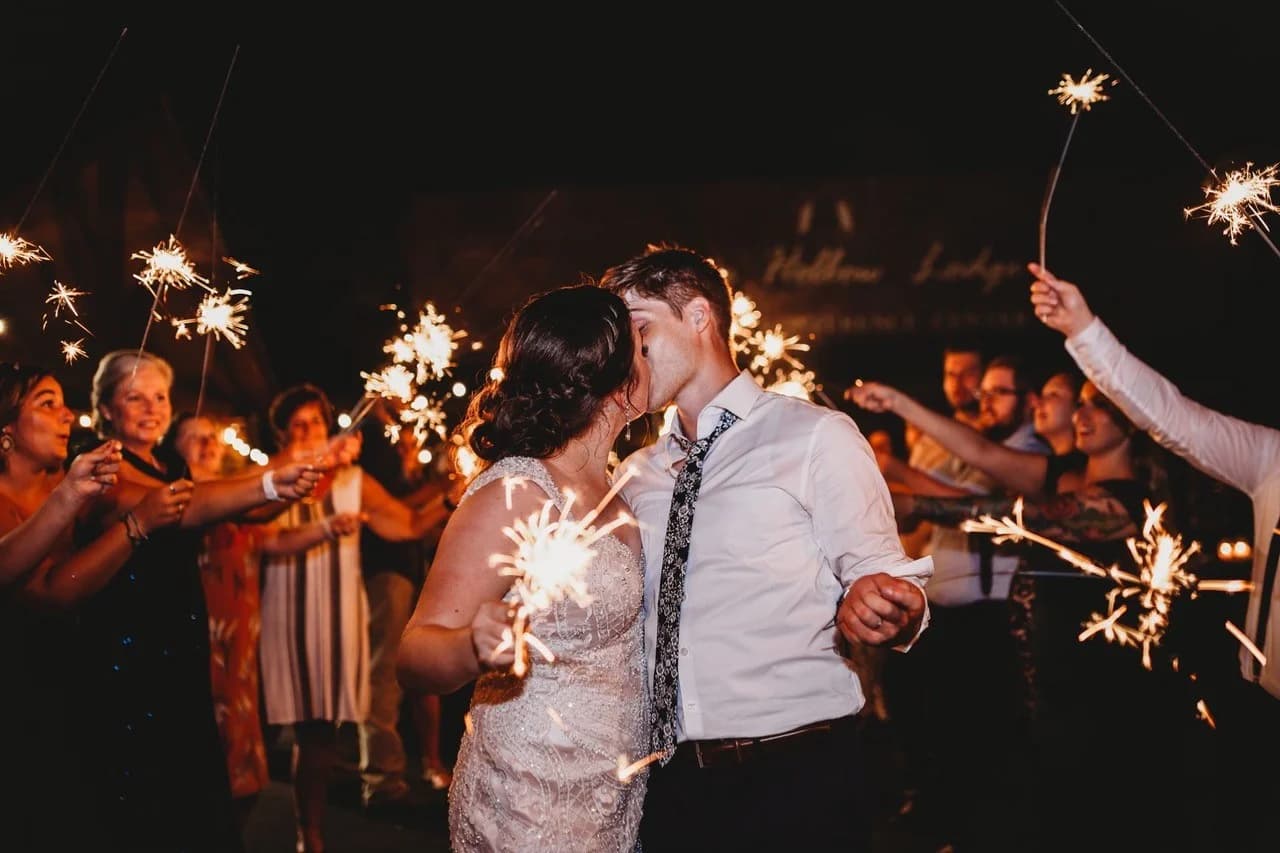 Wedding sparkler send-off with kissing bride and groom at Moose Hollow Lodge in Pigeon Forge near Dollywood
