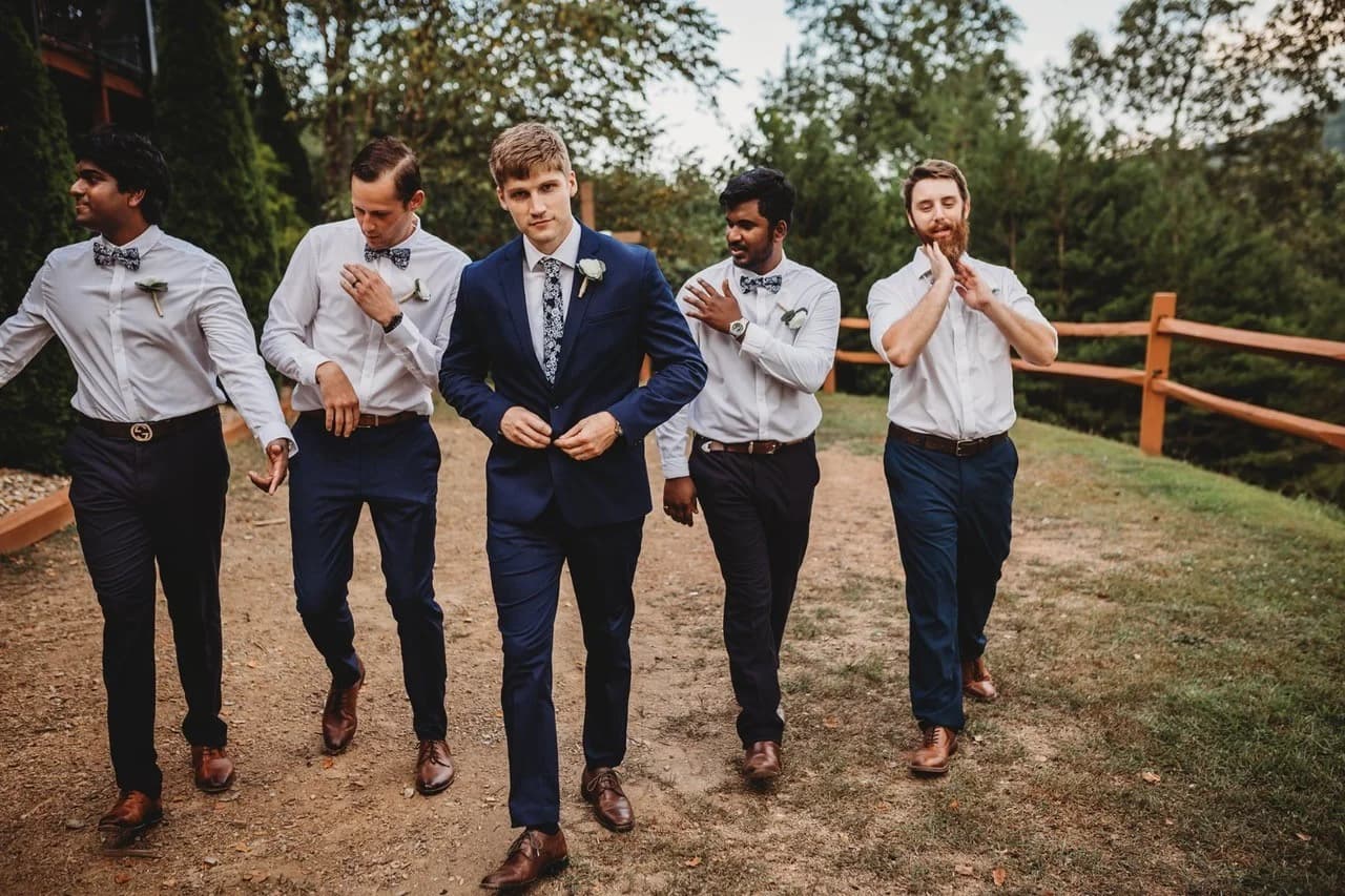 Groom and groomsmen walking outdoors at Moose Hollow Lodge in Pigeon Forge near Dollywood and Smoky Mountains
