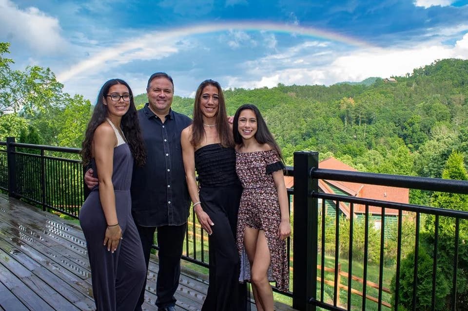 Rainbow over scenic Smoky Mountain views from a cabin deck near Dollywood at Moose Hollow Lodge in Pigeon Forge