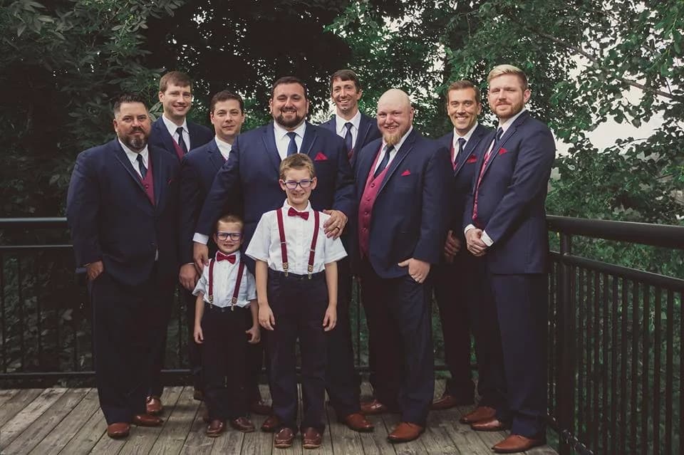 Groomsmen posing on a deck with forest views near the Smoky Mountains at Moose Hollow Lodge in Pigeon Forge