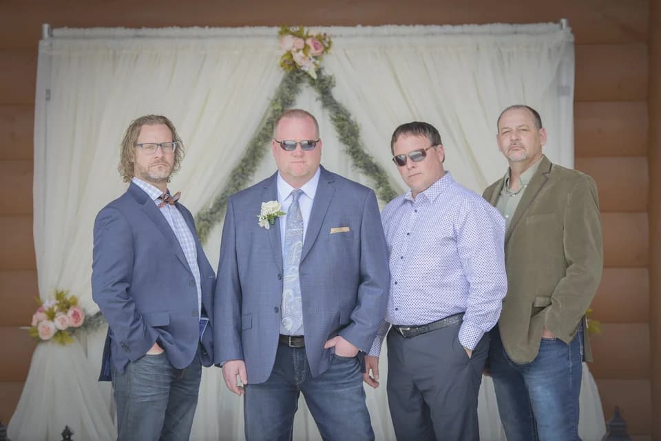 Groom and groomsmen at wedding ceremony site near Smoky Mountains at Moose Hollow Lodge in Pigeon Forge