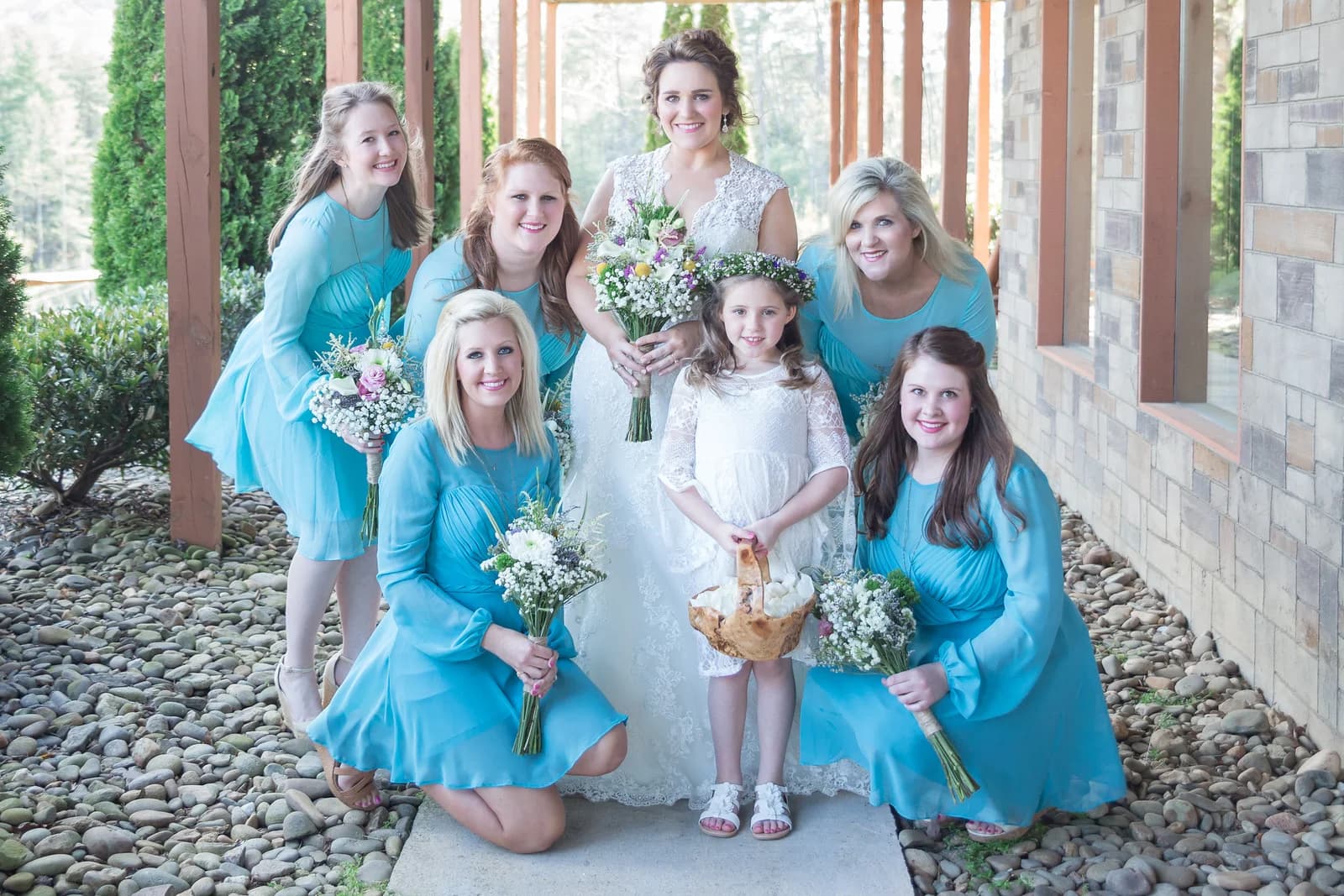 Bride and bridesmaids in blue at Moose Hollow Lodge wedding venue in Pigeon Forge near Dollywood and the Smoky Mountains