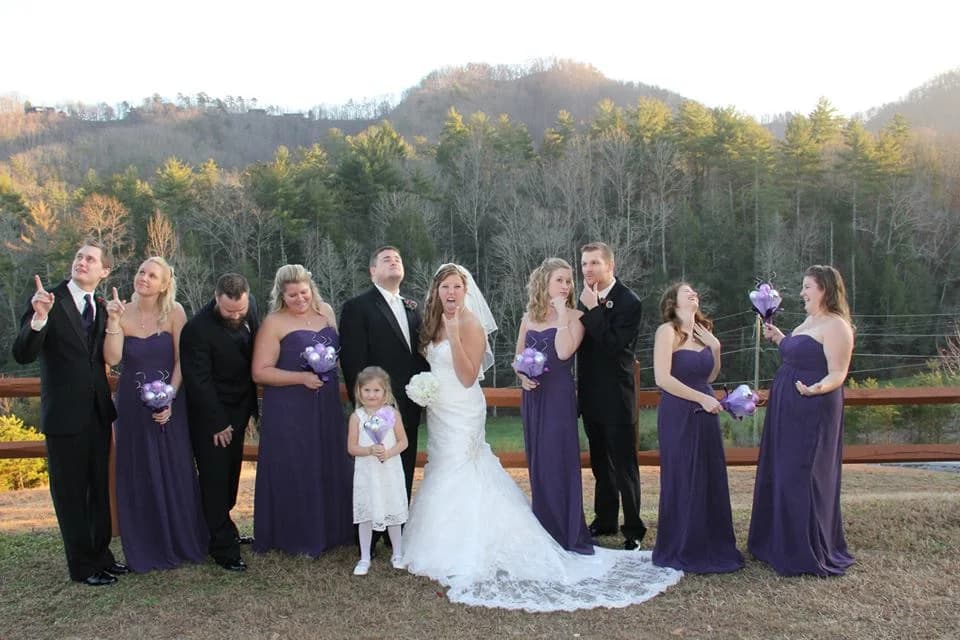 Playful outdoor wedding party portrait with Smoky Mountain views at Moose Hollow Lodge in Pigeon Forge near Dollywood
