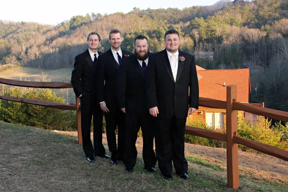 Groomsmen posing with scenic Smoky Mountains views at Moose Hollow Lodge in Pigeon Forge near Dollywood