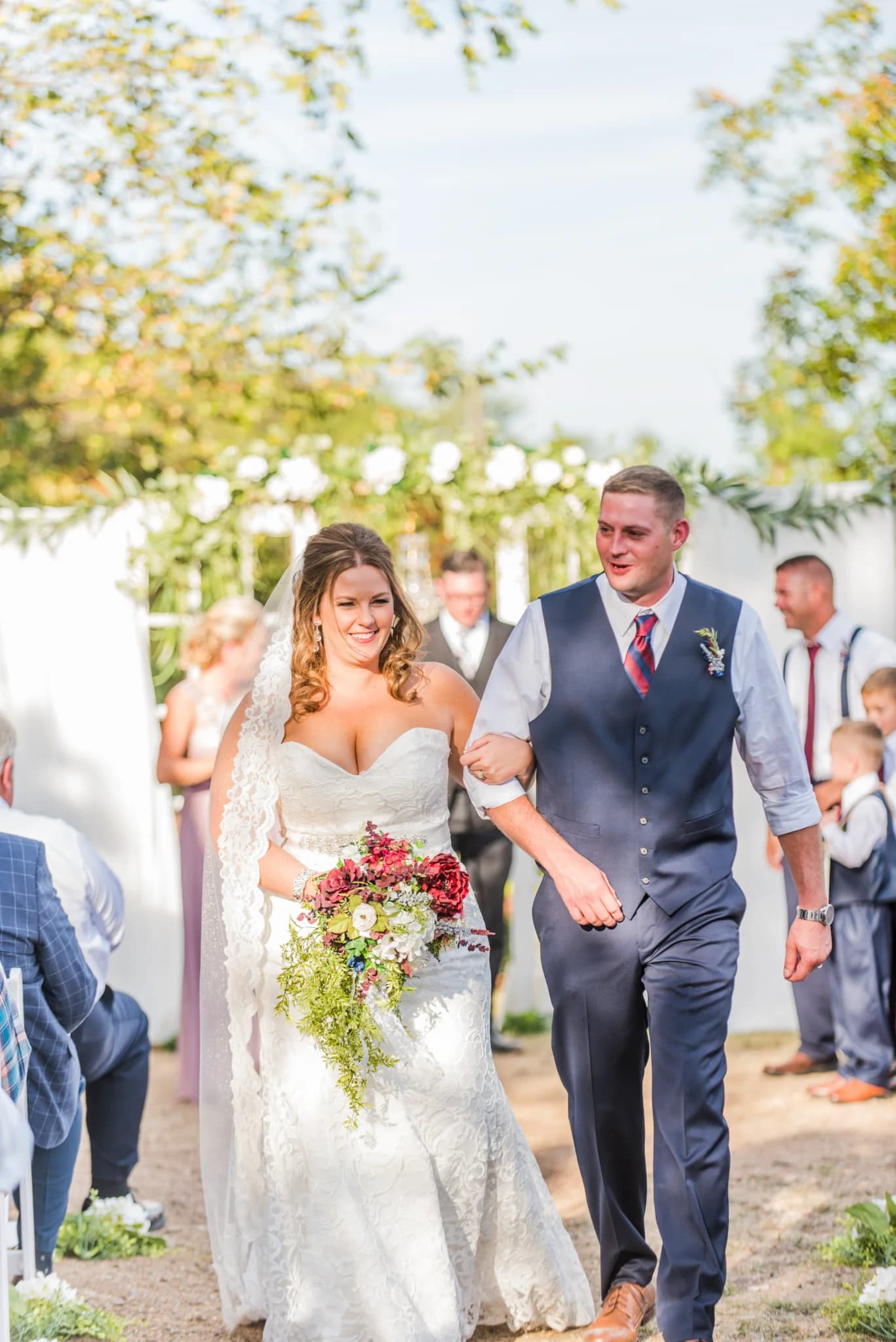 Bride and groom walking down aisle at outdoor wedding ceremony at Moose Hollow Lodge in Pigeon Forge near Smoky Mountains