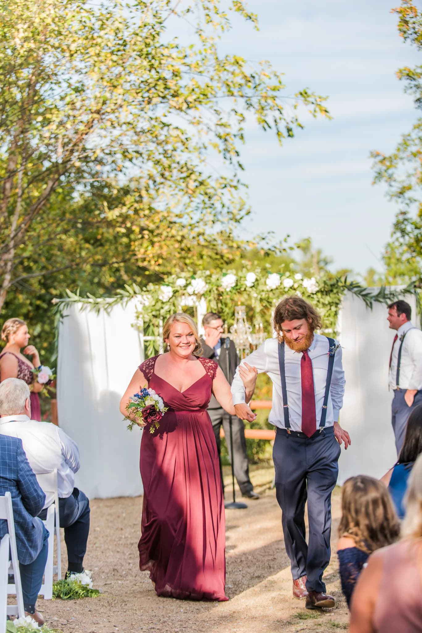Outdoor wedding ceremony aisle with floral backdrop at Moose Hollow Lodge in Pigeon Forge near the Smoky Mountains