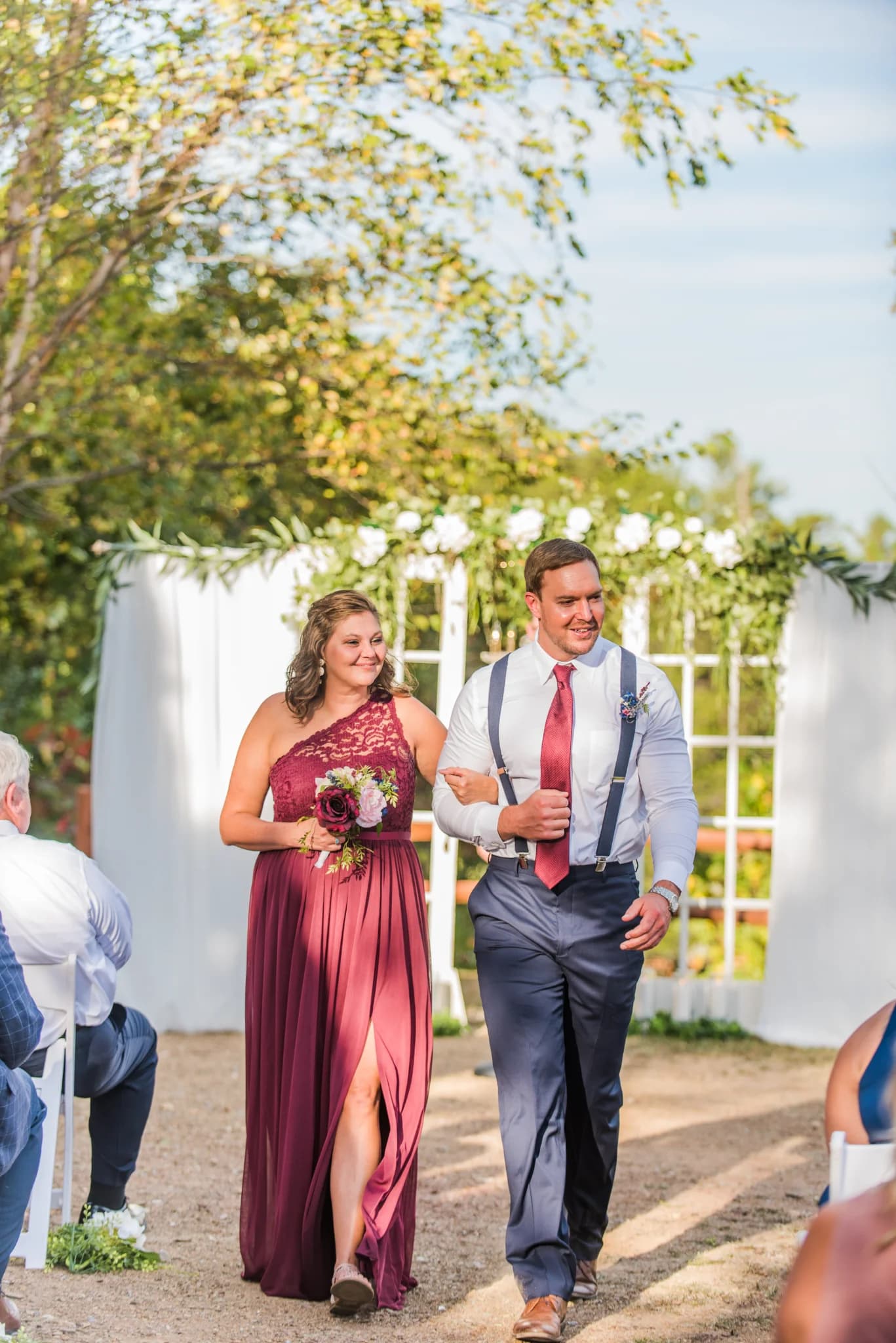 Bridal party walks outdoor ceremony aisle at Moose Hollow Lodge in Pigeon Forge near Dollywood and Smoky Mountains.