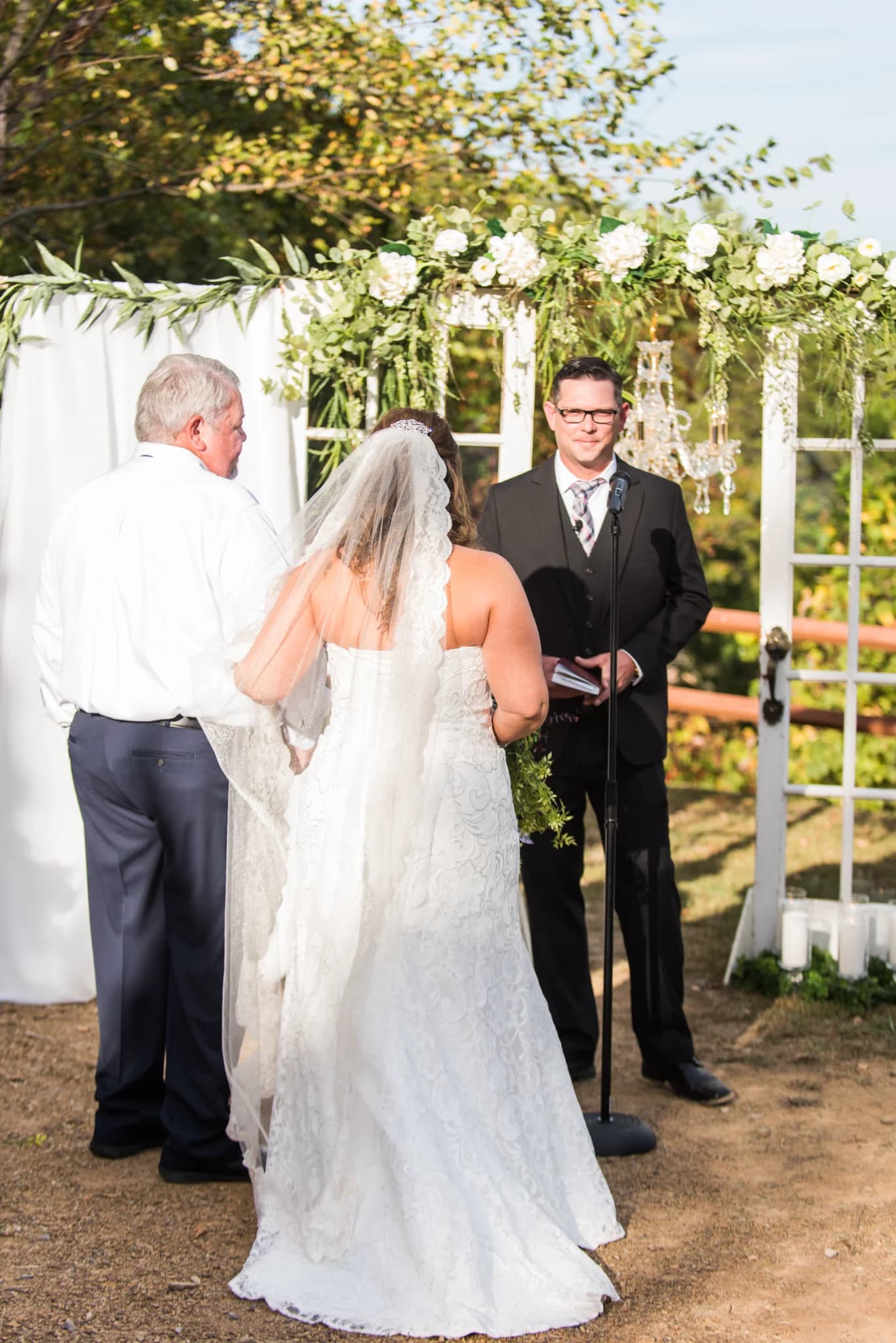 Outdoor wedding ceremony with floral arch at Moose Hollow Lodge in Pigeon Forge near Dollywood and Smoky Mountains