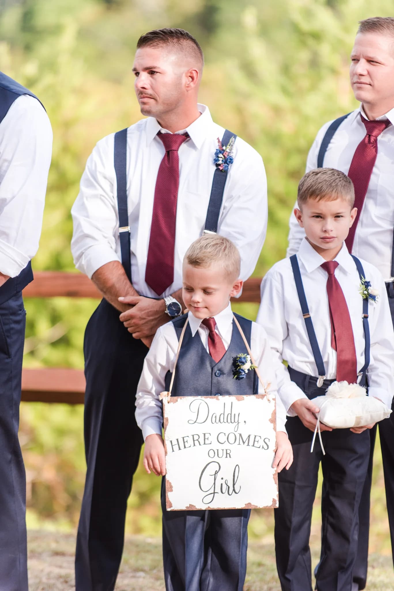 Ring bearer and boy with sign at outdoor wedding ceremony at Moose Hollow Lodge in Pigeon Forge near Smoky Mountains