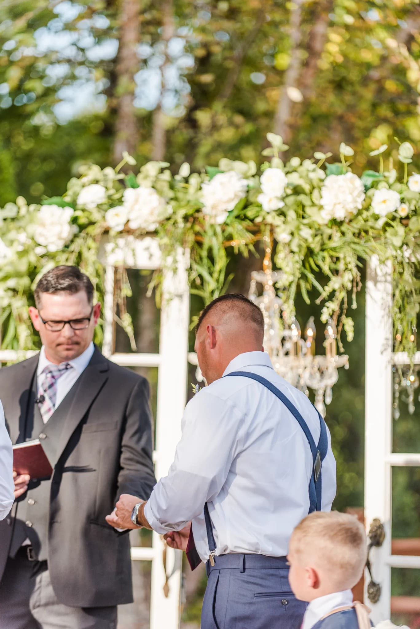 Outdoor wedding ceremony venue with floral arbor at Moose Hollow Lodge in Pigeon Forge near the Smoky Mountains.