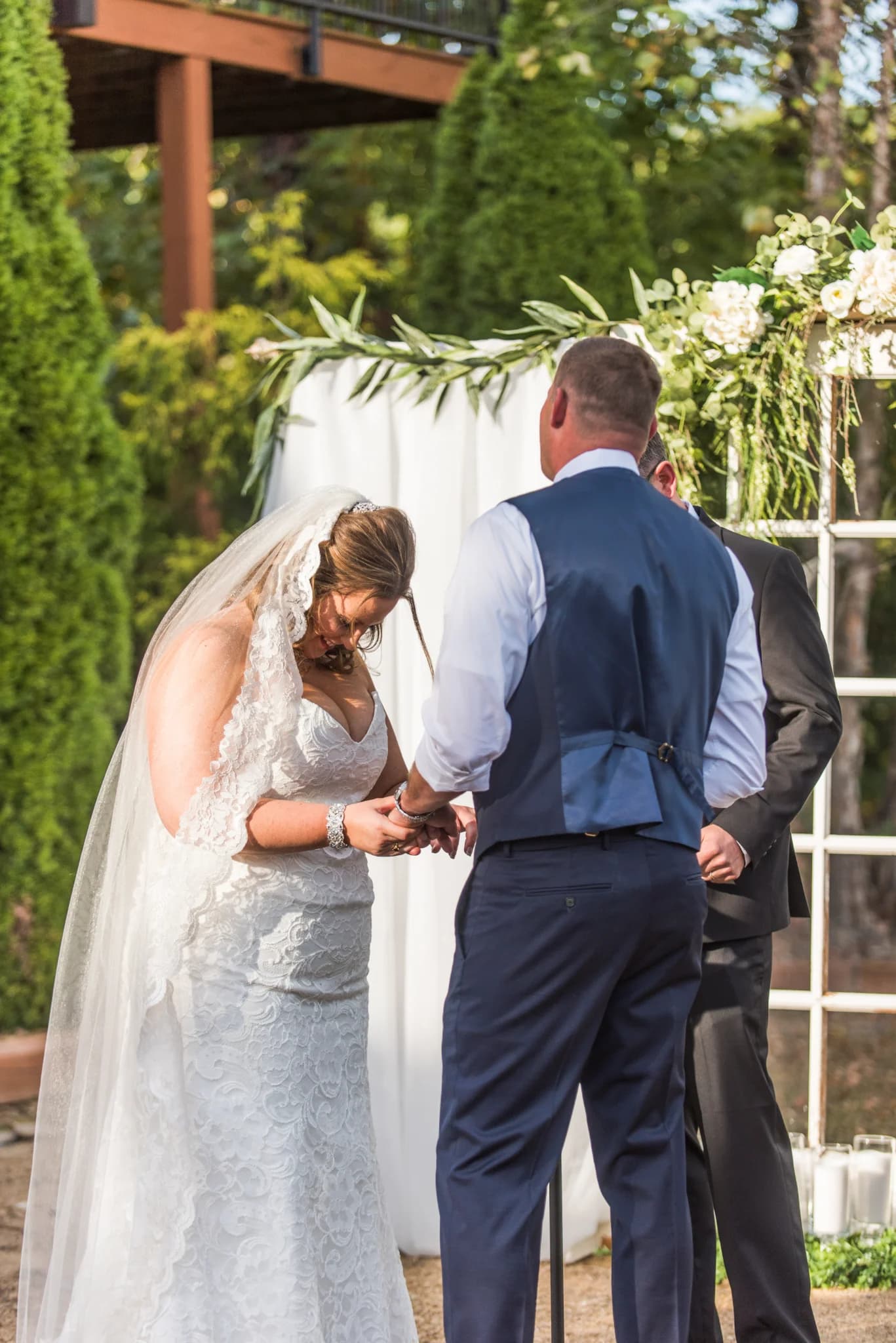 Outdoor wedding ceremony under floral arch at Moose Hollow Lodge near Dollywood in the Smoky Mountains