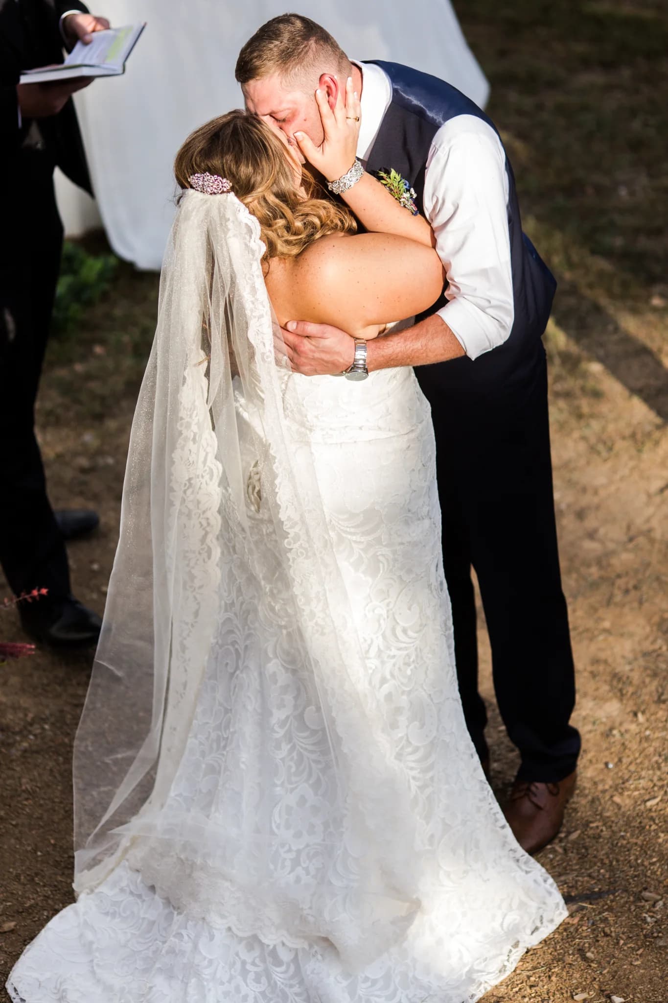 Bride and groom kiss at outdoor ceremony near the Smoky Mountains at Moose Hollow Lodge in Pigeon Forge