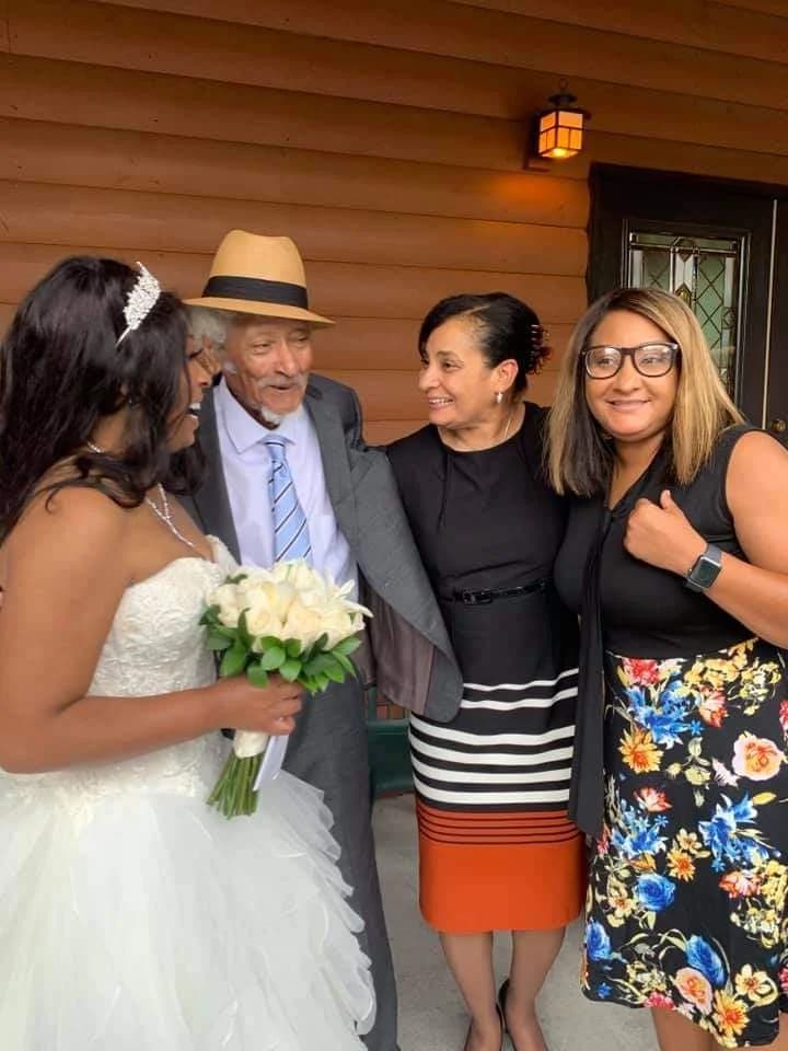 Bride and guests on the log cabin porch at Moose Hollow Lodge near Dollywood in the Smoky Mountains