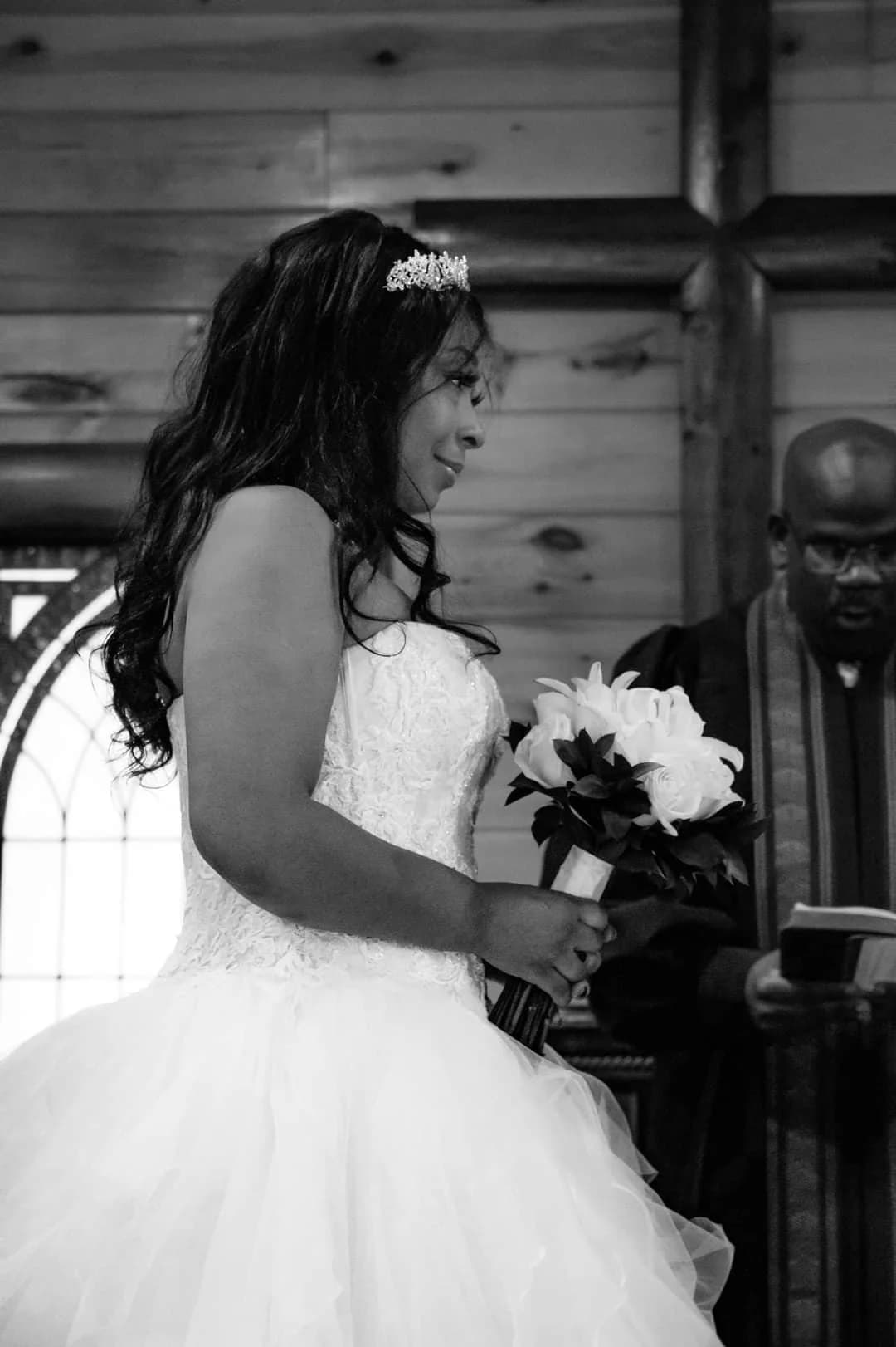 Bride at altar in rustic wood wedding chapel at Moose Hollow Lodge in Pigeon Forge