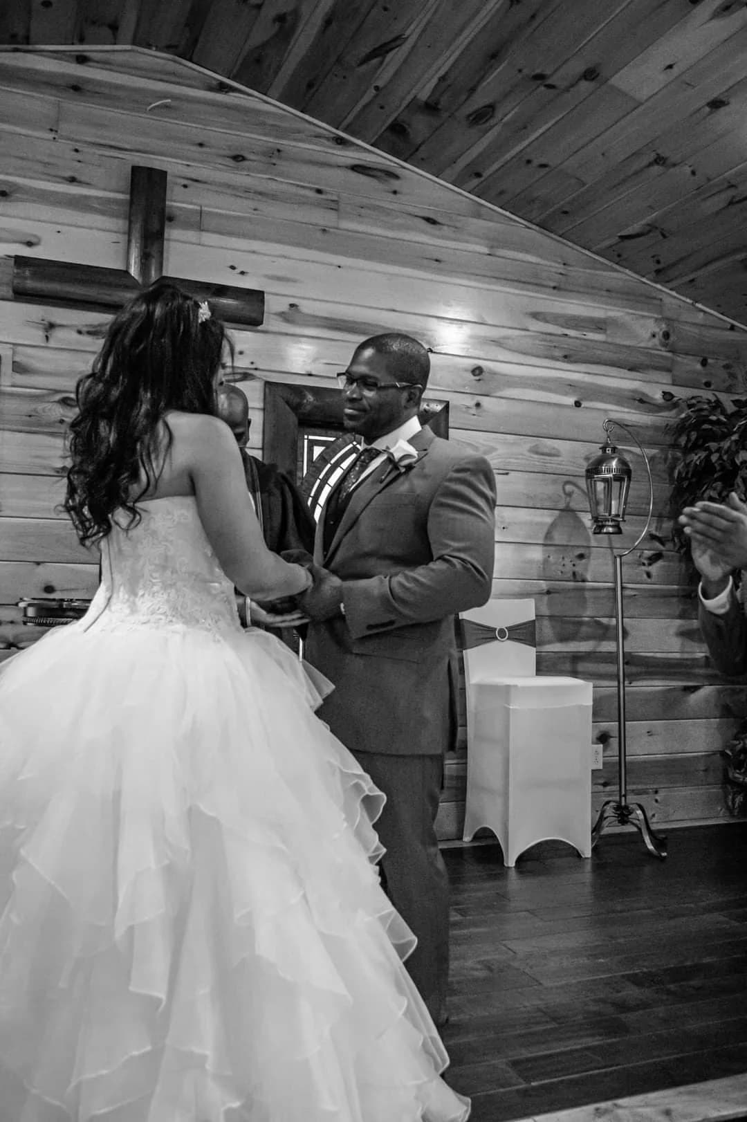 Bride and groom exchange vows in a rustic wood-paneled chapel at Moose Hollow Lodge in Pigeon Forge