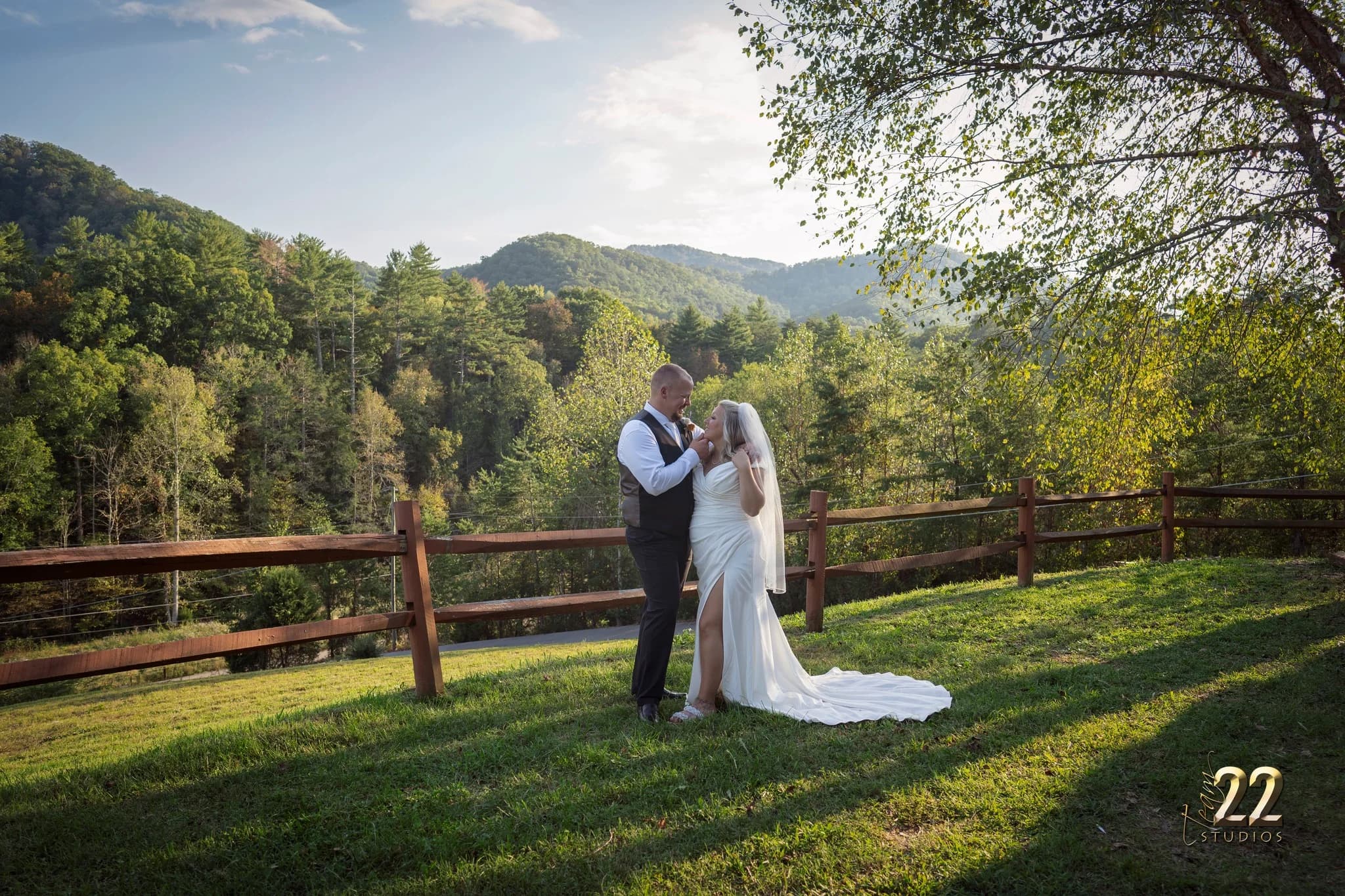 Wedding couple on a hillside with scenic mountain views at Moose Hollow Lodge near Dollywood in the Smoky Mountains