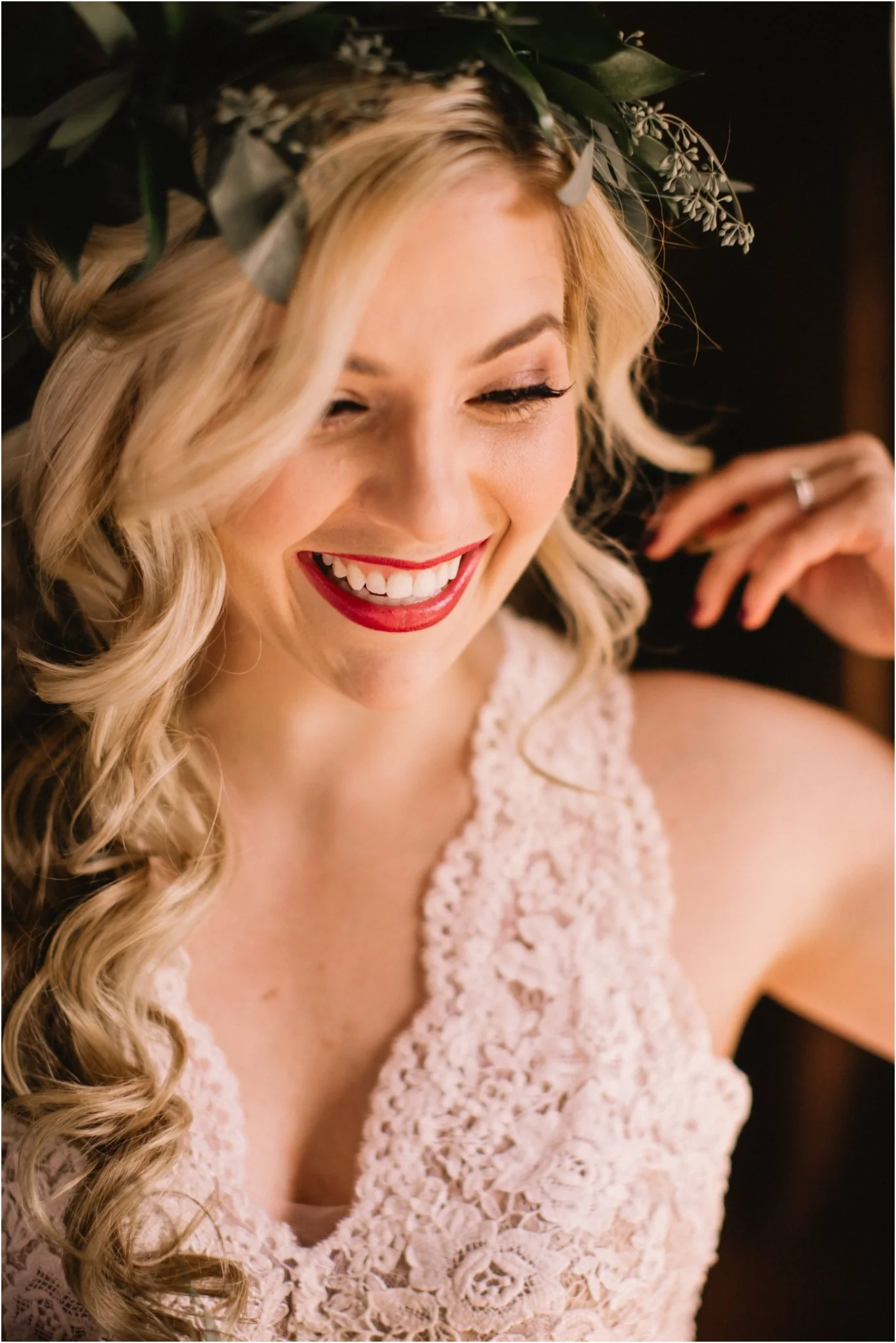 Smiling bride in lace wedding dress and floral crown at Moose Hollow Lodge in Pigeon Forge