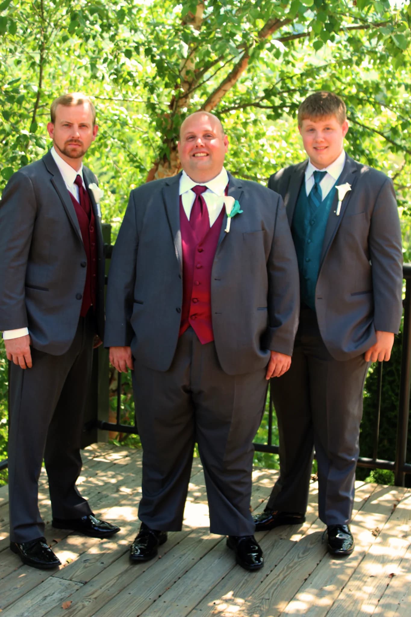 Groom and groomsmen on an outdoor deck with forest views near Dollywood at Moose Hollow Lodge in Pigeon Forge