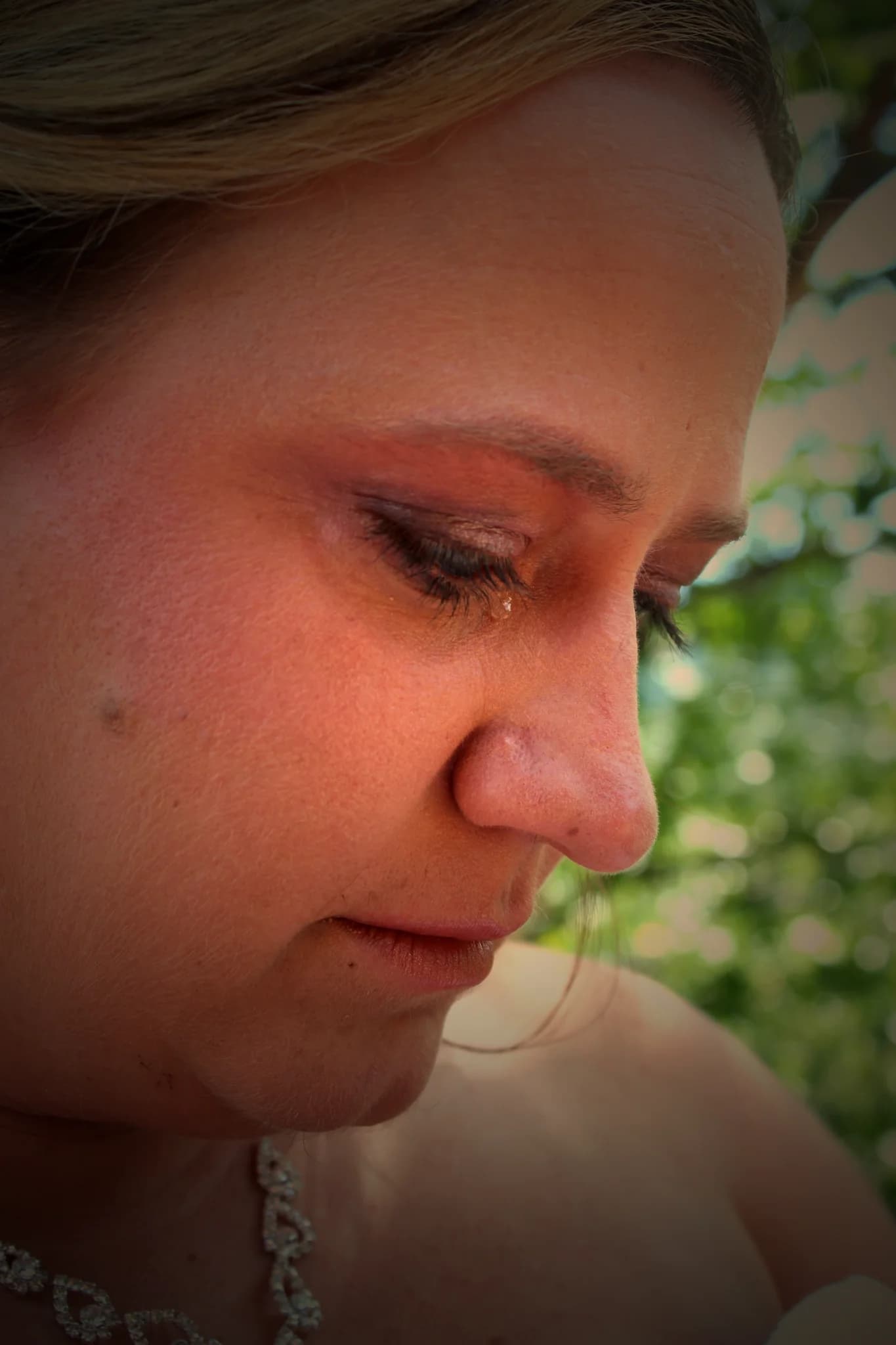 Close-up of an emotional bride shedding a tear at Moose Hollow Lodge in Pigeon Forge near the Smoky Mountains