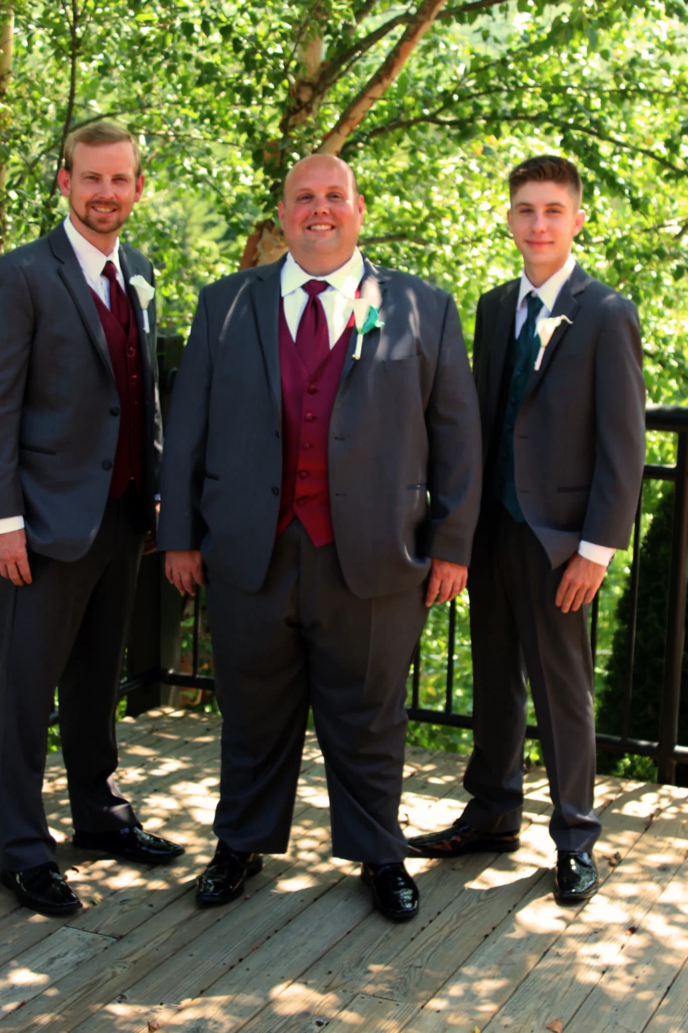 Groomsmen on a scenic outdoor deck with forest views at Moose Hollow Lodge in Pigeon Forge near the Smoky Mountains