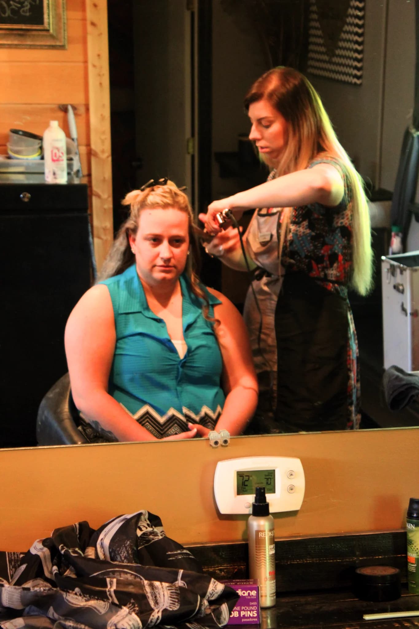 Bride getting hair styled in the bridal suite at Moose Hollow Lodge in Pigeon Forge