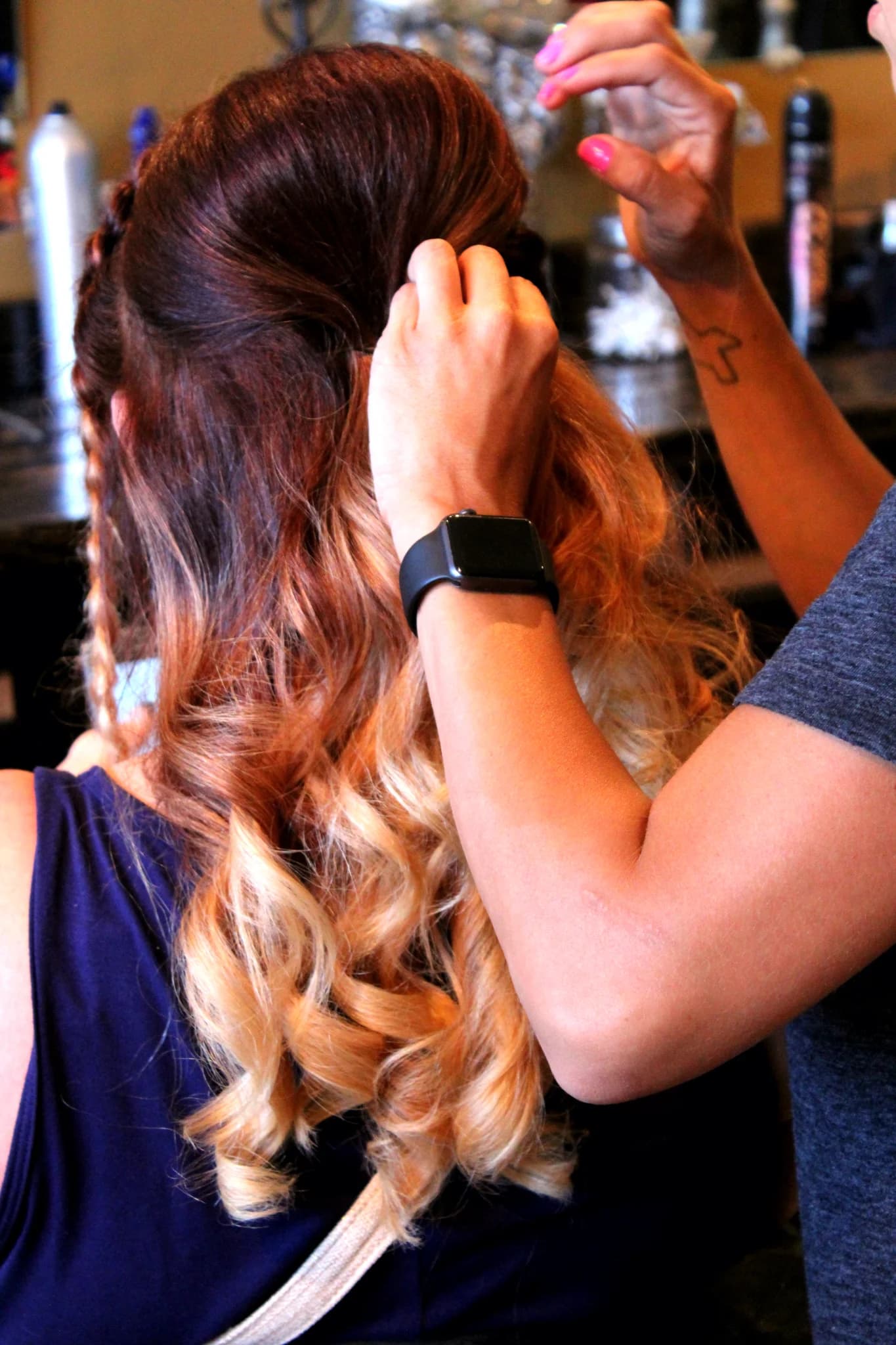 Bridal hair styling with elegant ombre curls for wedding prep at Moose Hollow Lodge in Pigeon Forge