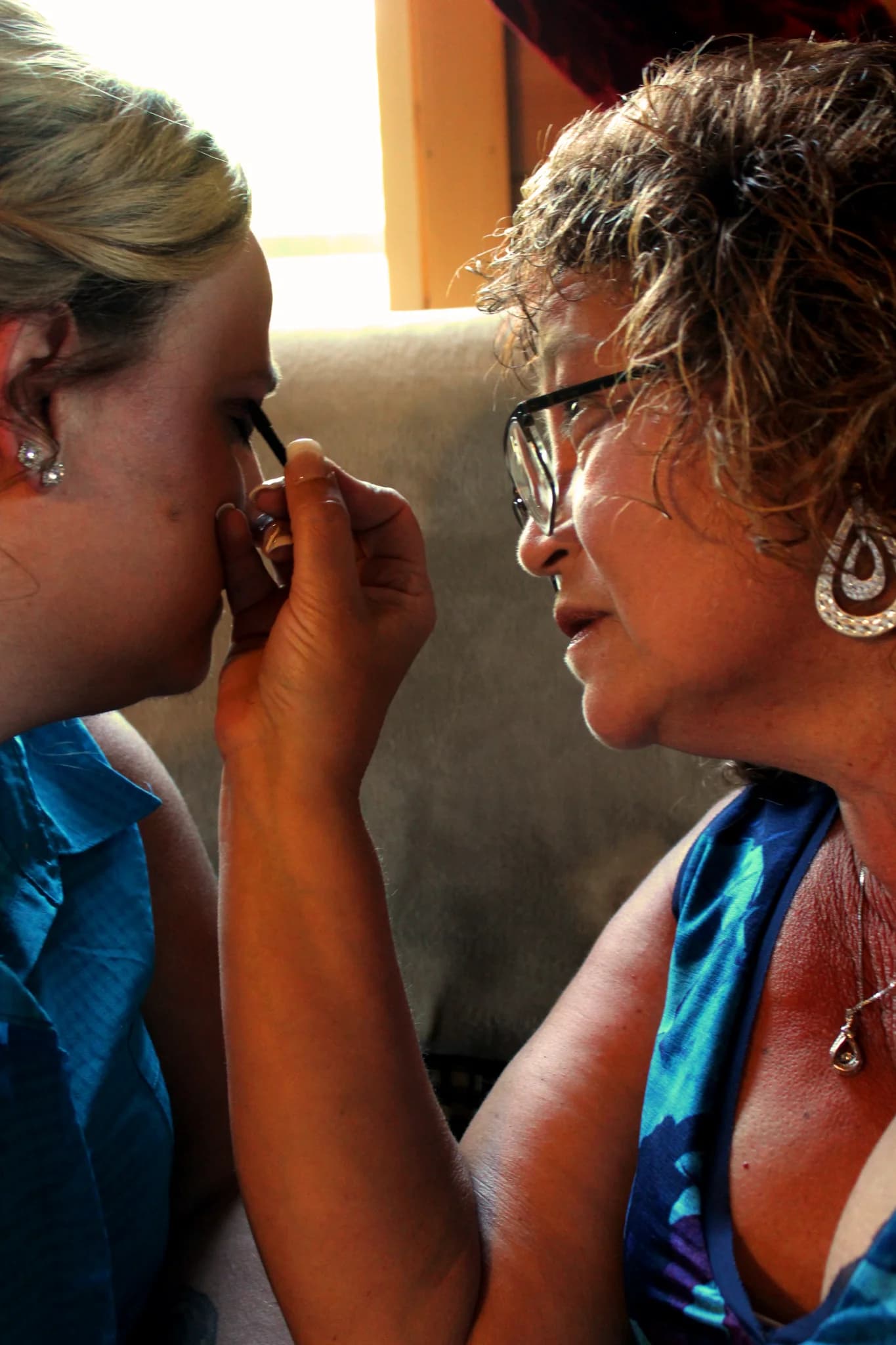 Bridal makeup preparation for a wedding at Moose Hollow Lodge in Pigeon Forge